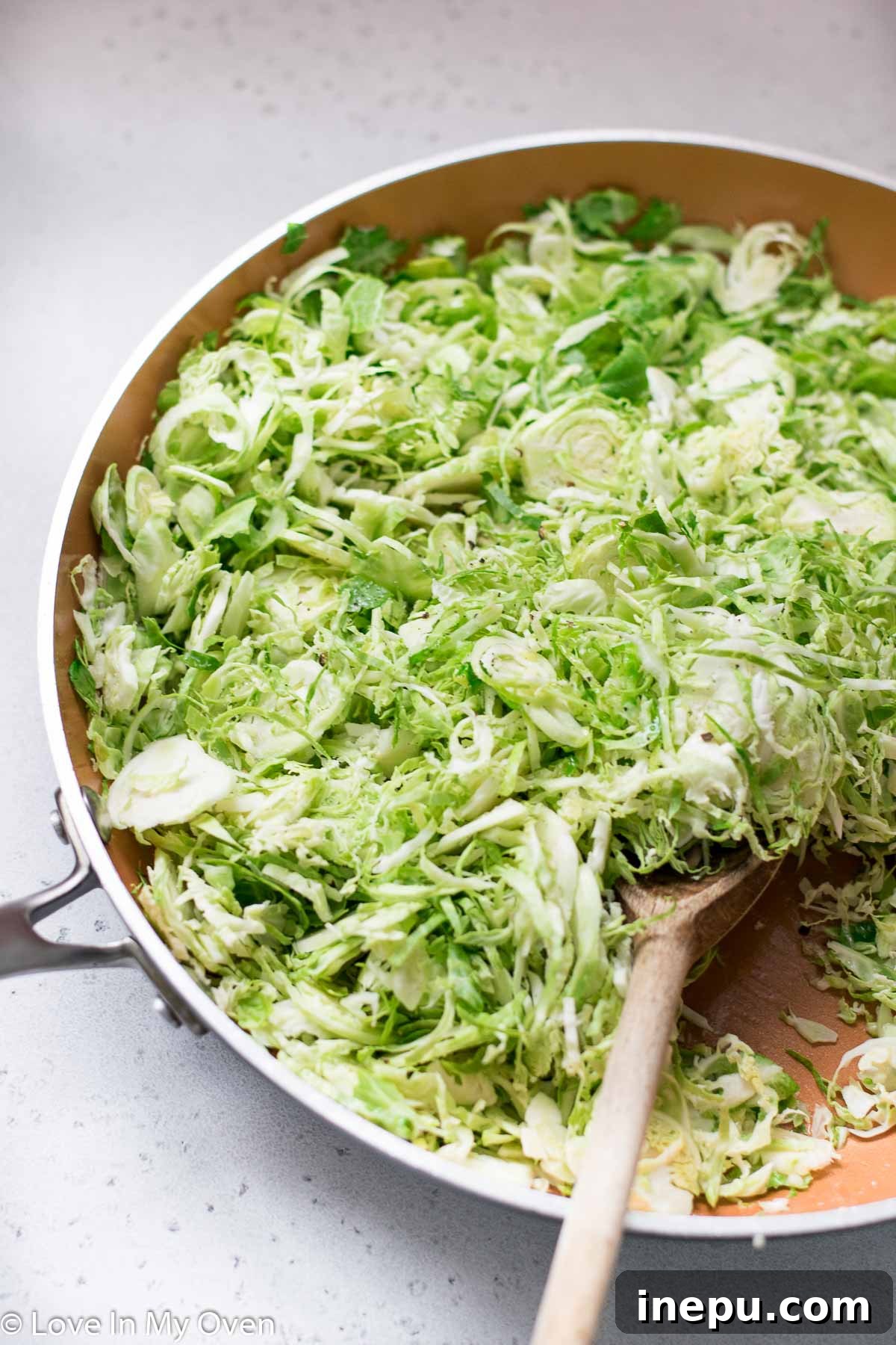 Crispy Shredded Brussels Sprouts with Garlic 6 Plated Sautéed Shredded Brussels Sprouts, garnished with lemon