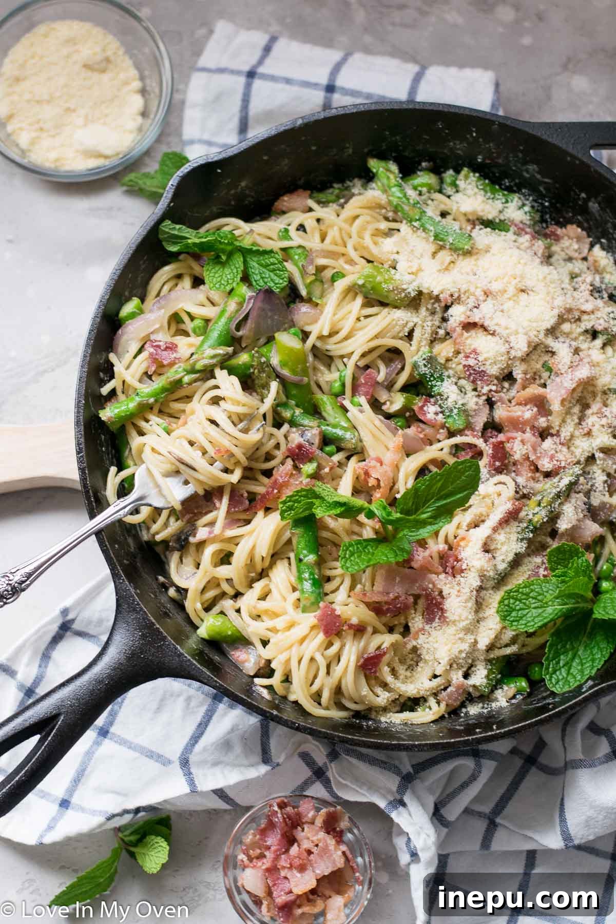 Springtime Carbonara with Asparagus and Peas 2 Creamy Spaghetti Carbonara with vibrant green peas and fresh asparagus, perfect for a spring meal