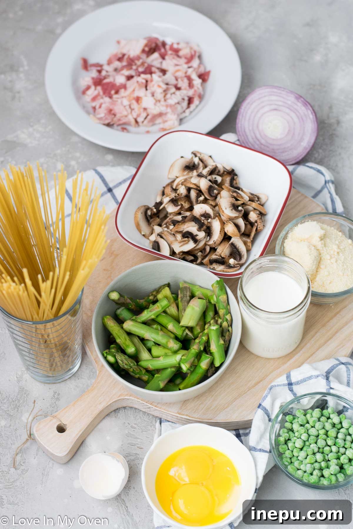 Springtime Carbonara with Asparagus and Peas 4 Ingredients for spaghetti carbonara including bacon, asparagus, peas, mushrooms, and eggs