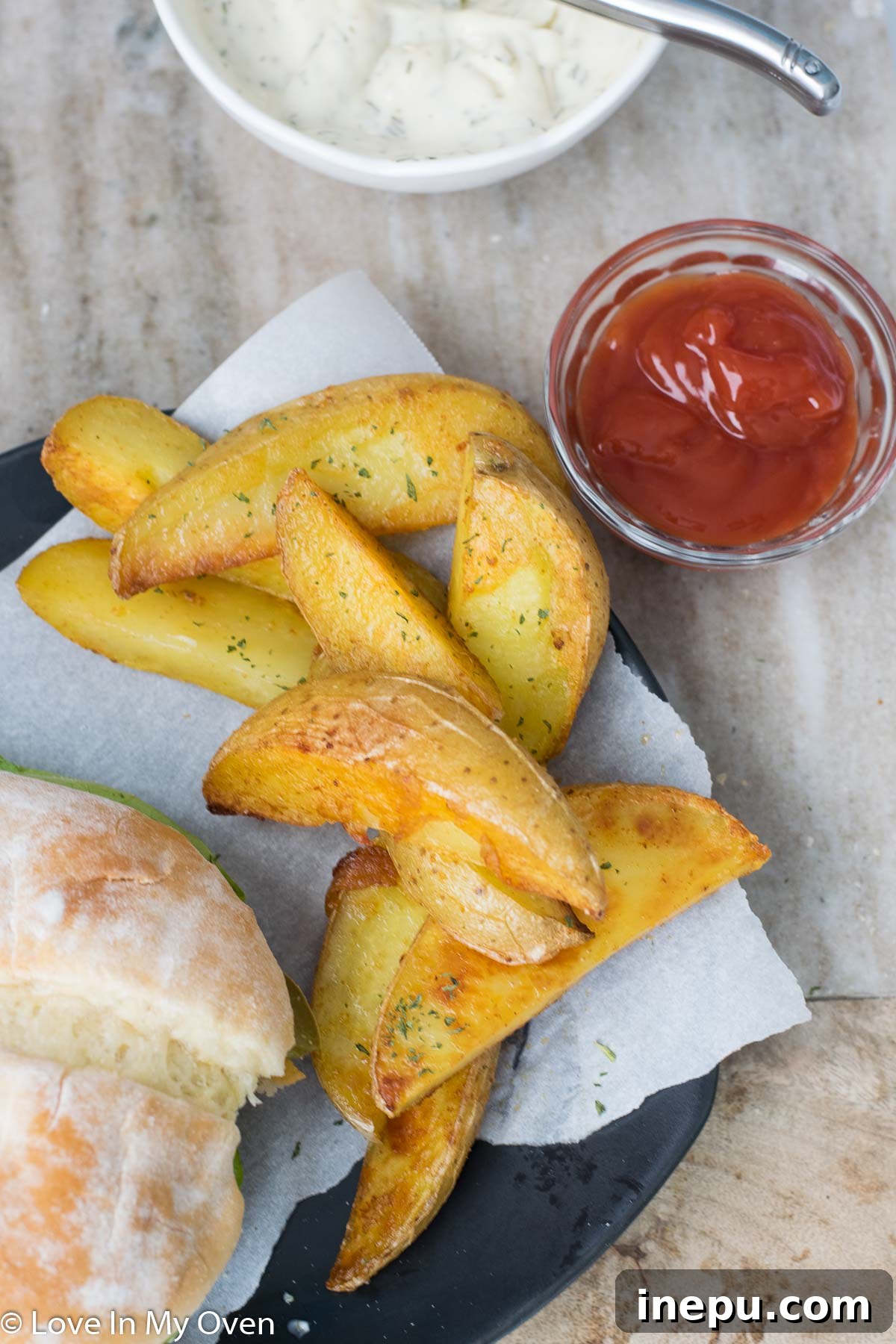 Serving crispy fish burgers with potato wedges