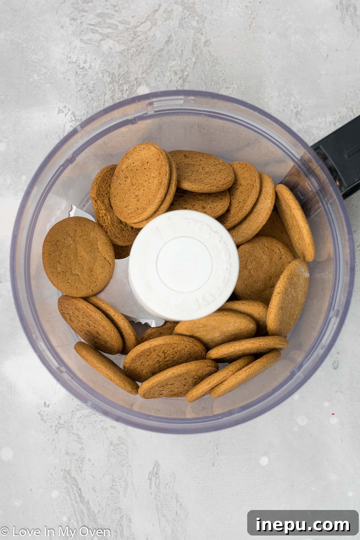 Crushing Gingersnap Cookies for the Tart Crust