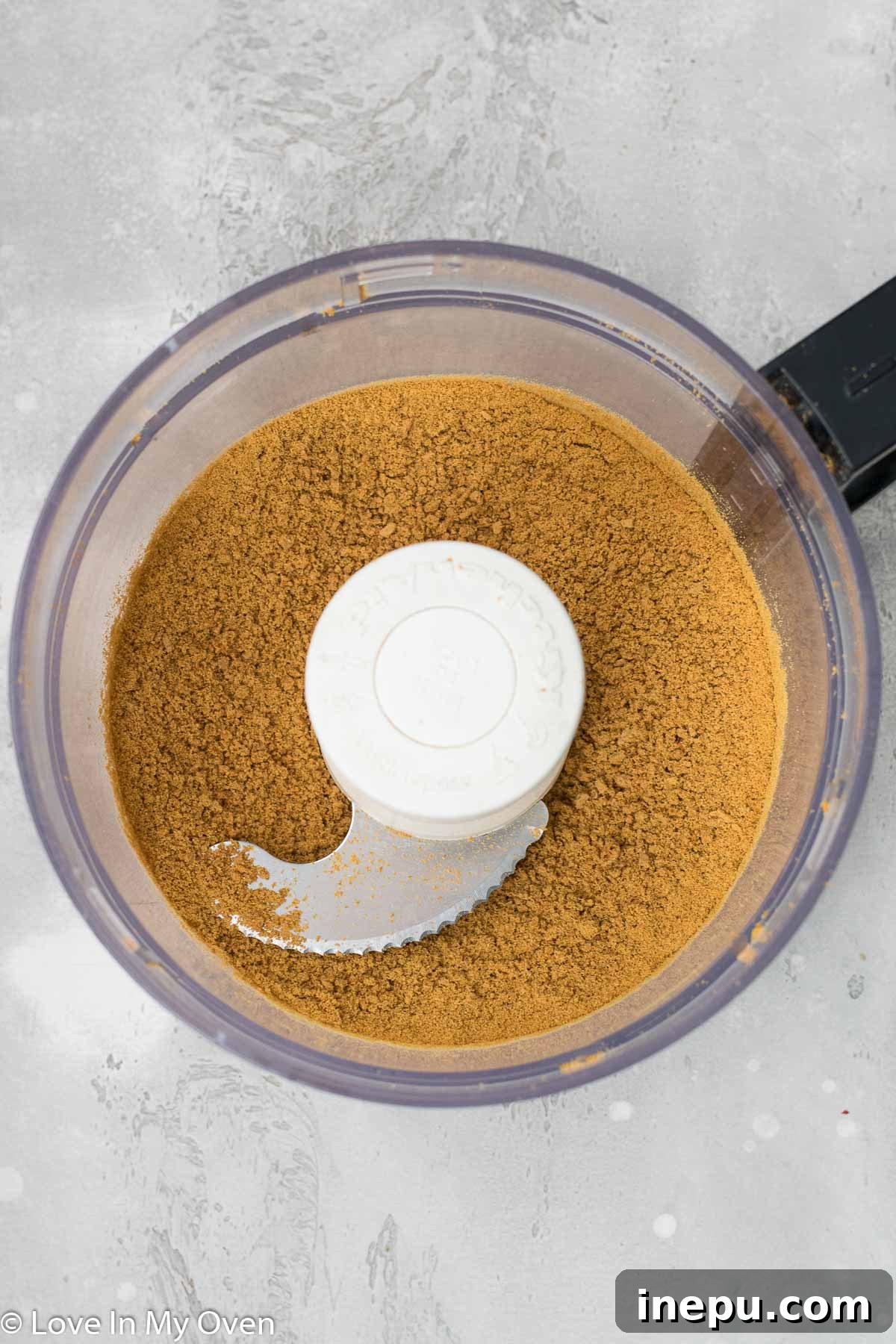 Mixing Gingersnap Crumbs with Melted Butter