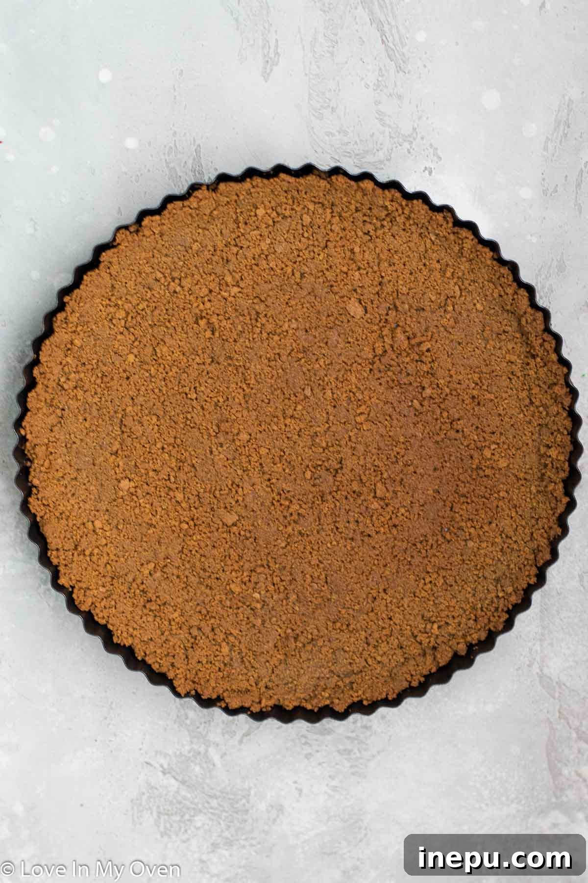 Pressing Gingersnap Crust into a Tart Pan