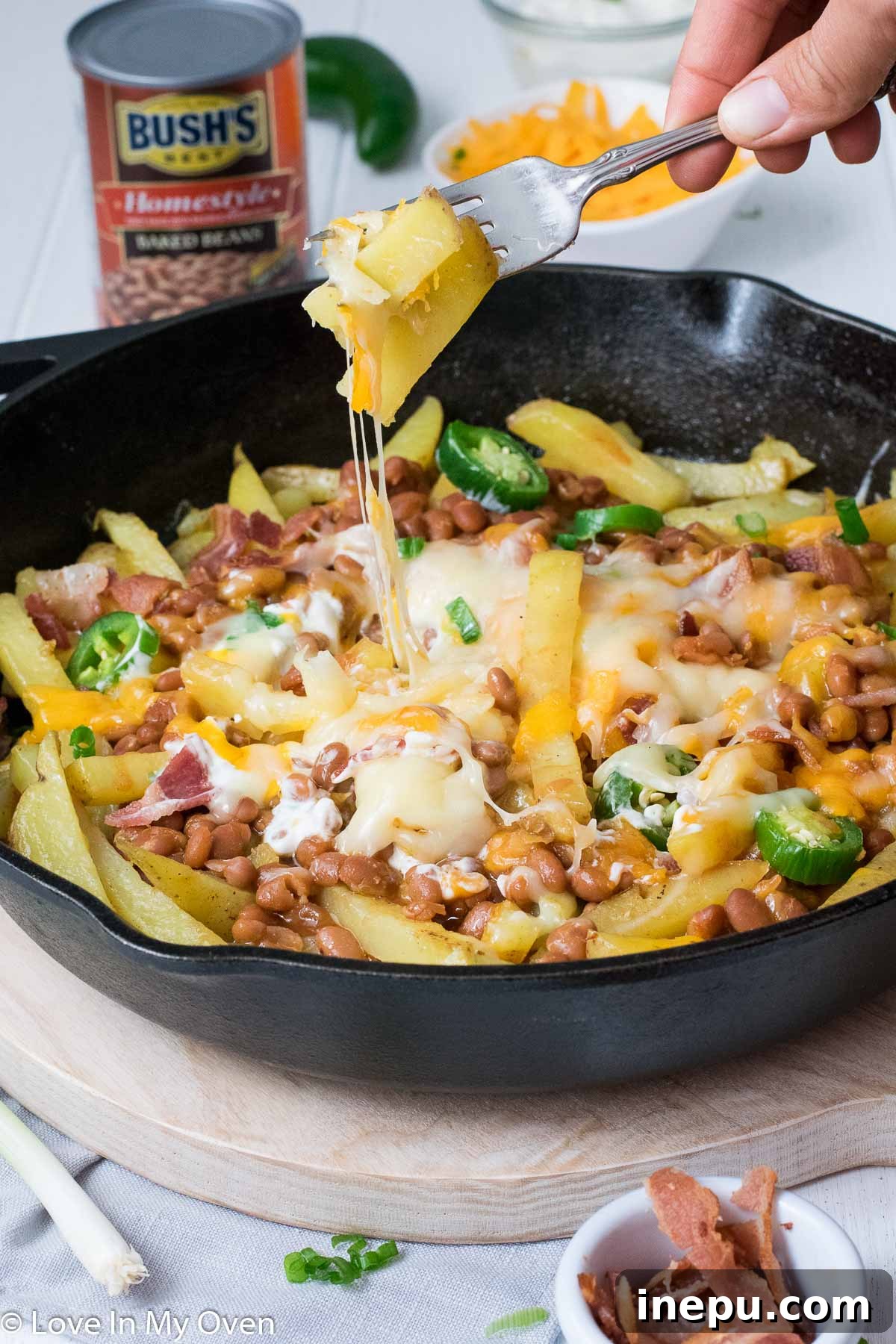 Delicious Skillet Loaded Cheese Fries ready to be served