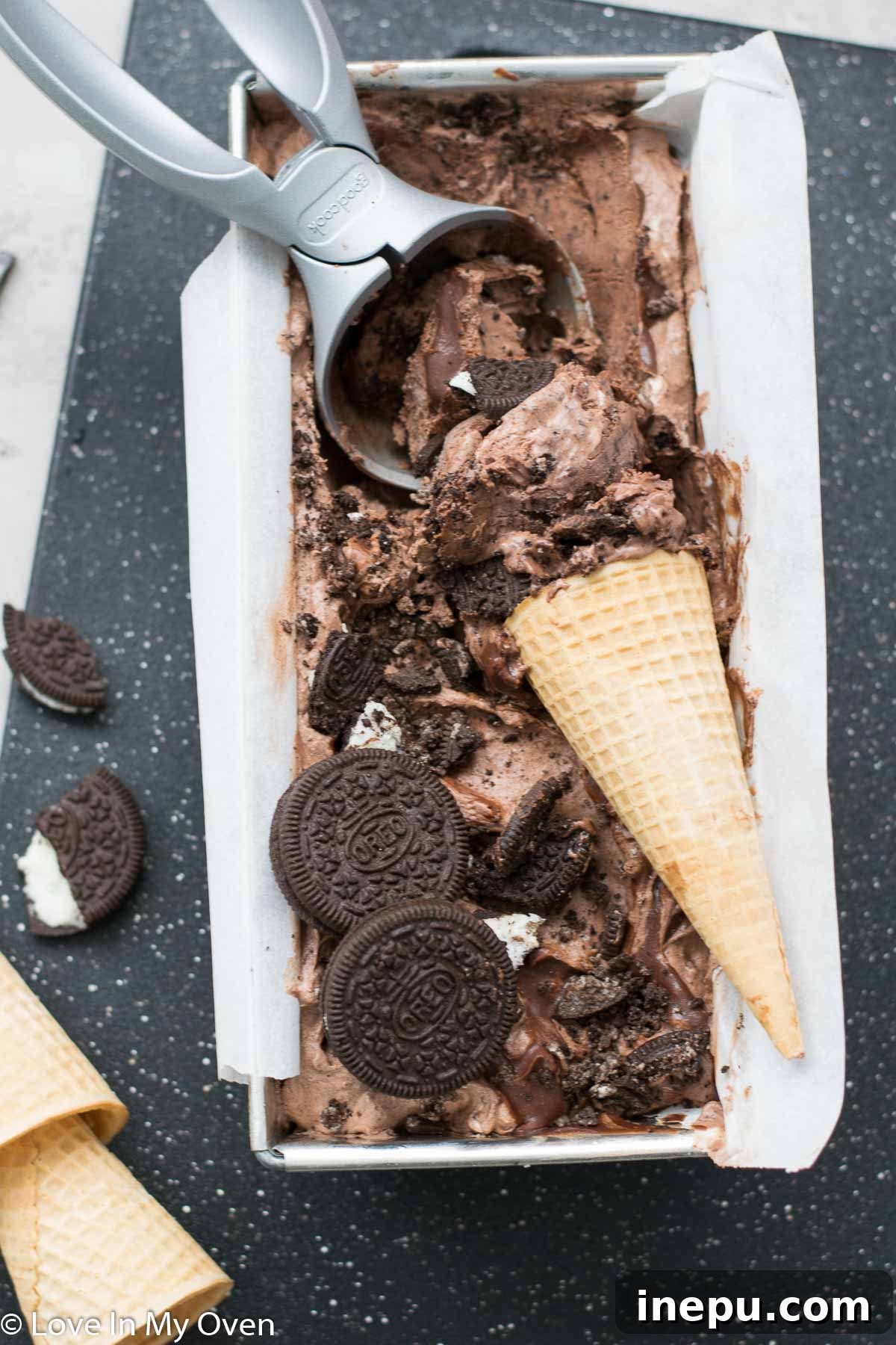 Decadent No-Churn Chocolate Oreo Delight 2 Decadent No-Churn Chocolate Oreo Ice Cream served in a bowl, garnished with Oreo pieces.
