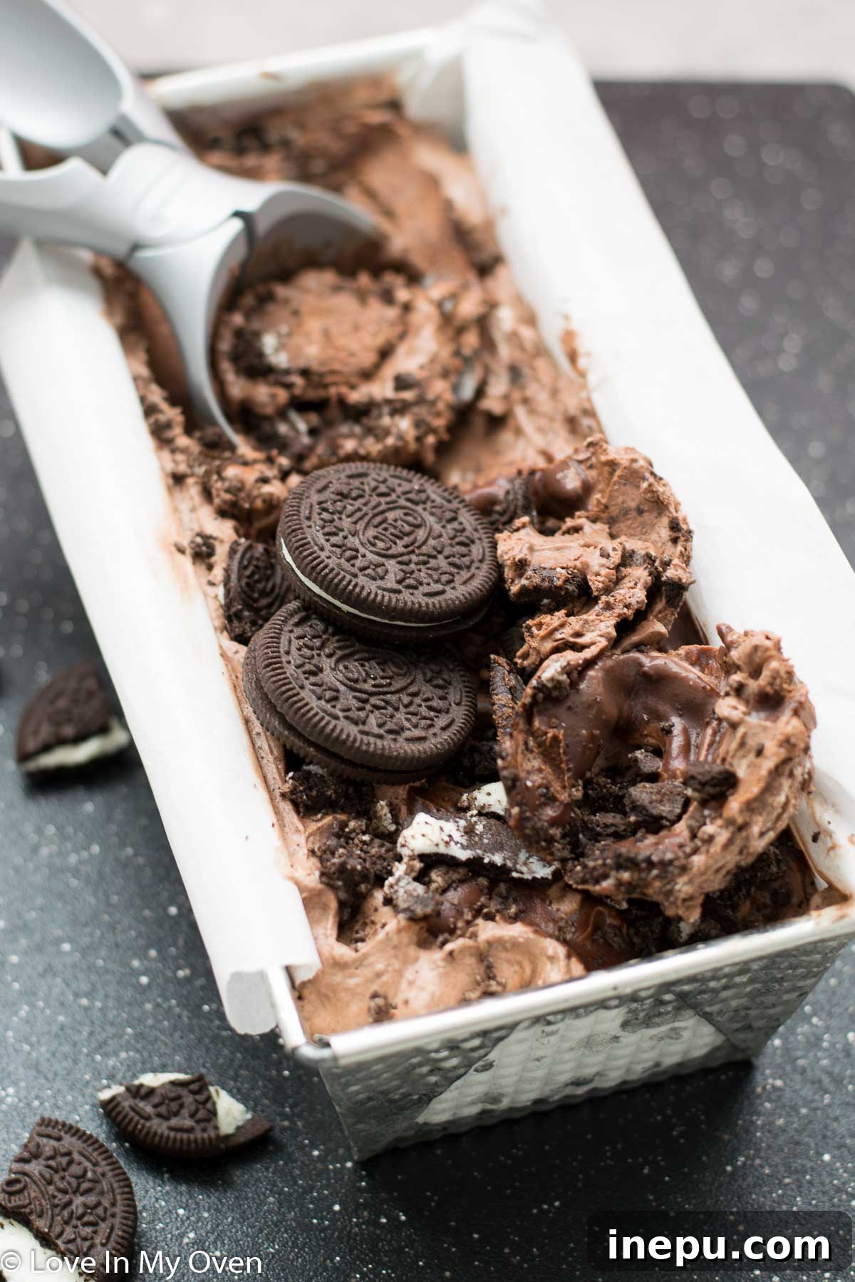Decadent No-Churn Chocolate Oreo Delight 3 Close-up of No-Churn Chocolate Oreo Ice Cream with visible Oreo chunks and chocolate swirls.