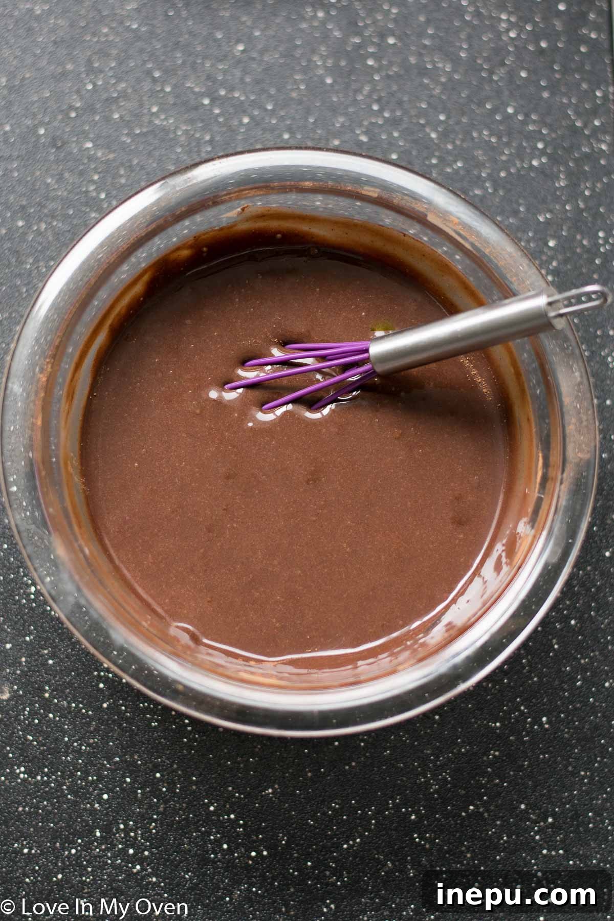 Decadent No-Churn Chocolate Oreo Delight 6 Whisking cocoa powder into sweetened condensed milk for the ice cream base.