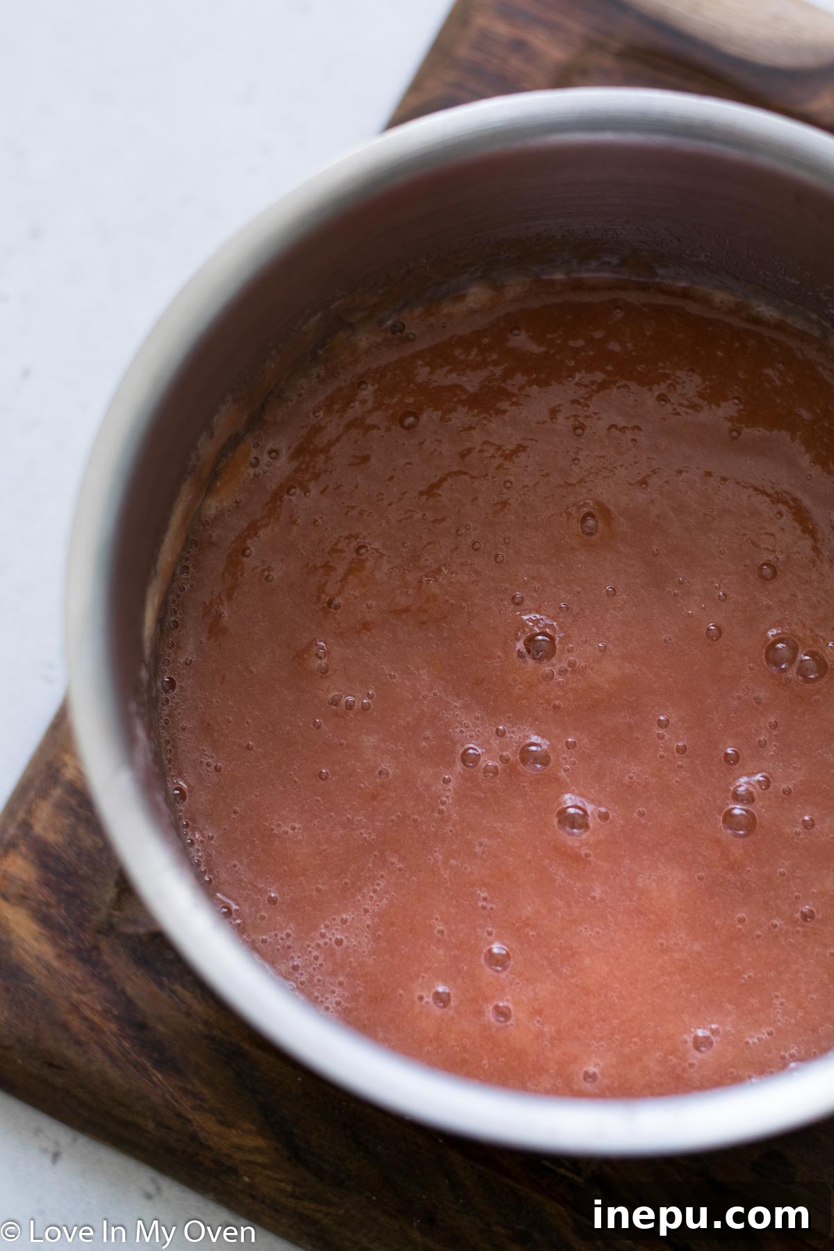 Smooth, blended rhubarb puree in the cooking pot