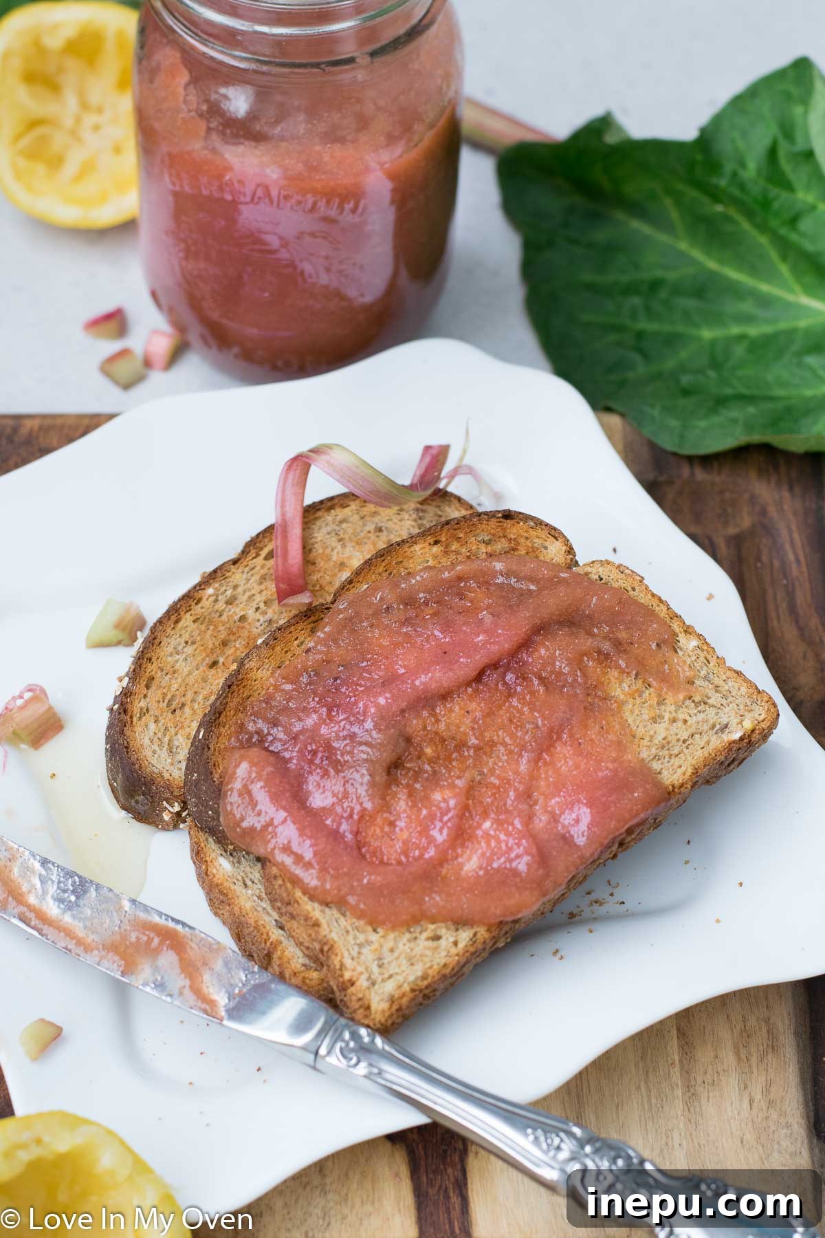 Close-up view of vibrant rhubarb butter in a small white bowl