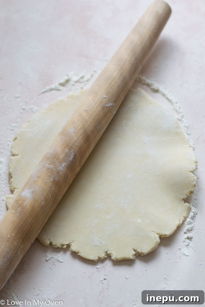 Rolling out pie dough for a pie crust