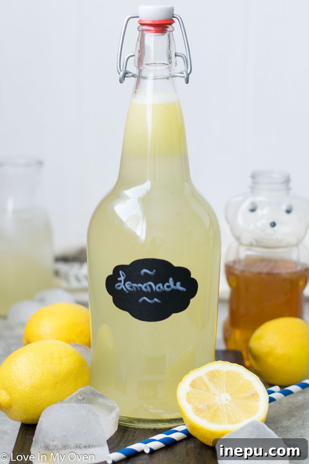 Effortless Honey Lemonade 2 Easy homemade honey lemonade in a glass pitcher with lemon slices