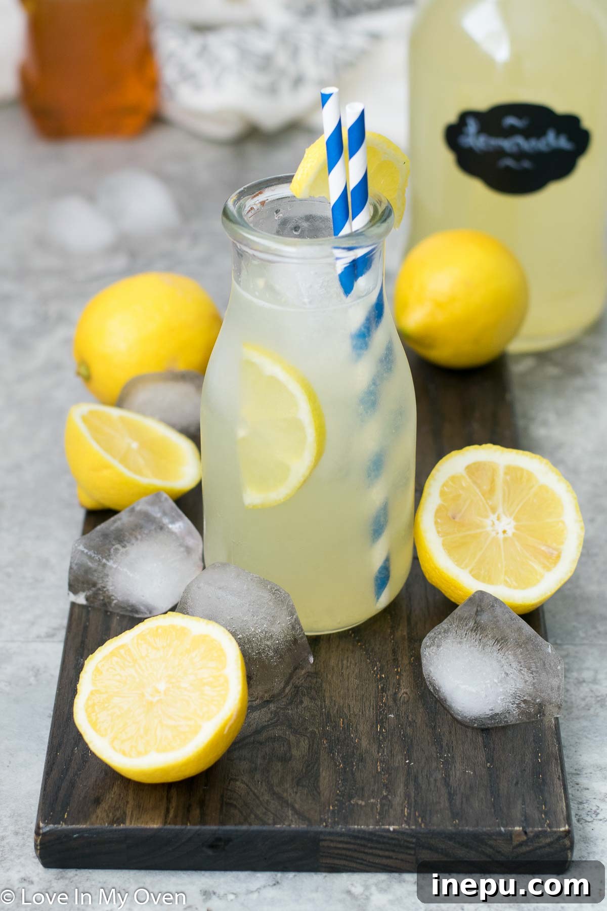 Effortless Honey Lemonade 3 Close-up of freshly squeezed lemons and a jar of honey, key ingredients for lemonade