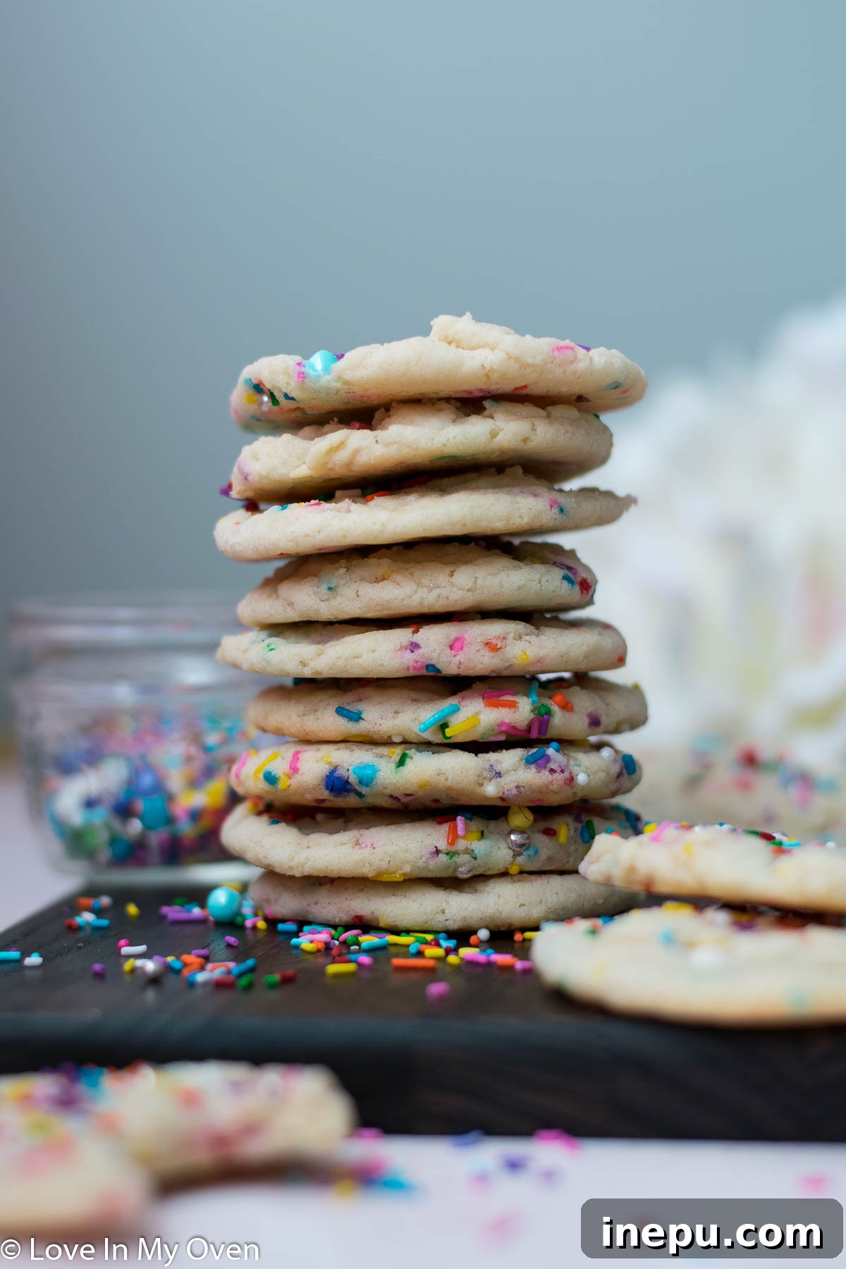 Whimsical Sprinkled Sugar Cookies 2 Vibrant sprinkle sugar cookies arranged on a cooling rack, showcasing their cheerful colors and soft texture.