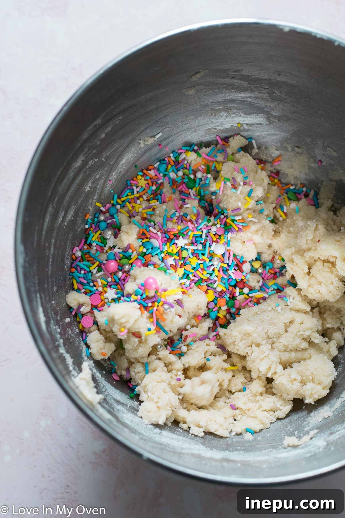 Whimsical Sprinkled Sugar Cookies 5 Cookie dough with colorful sprinkles mixed in, ready for scooping and baking.