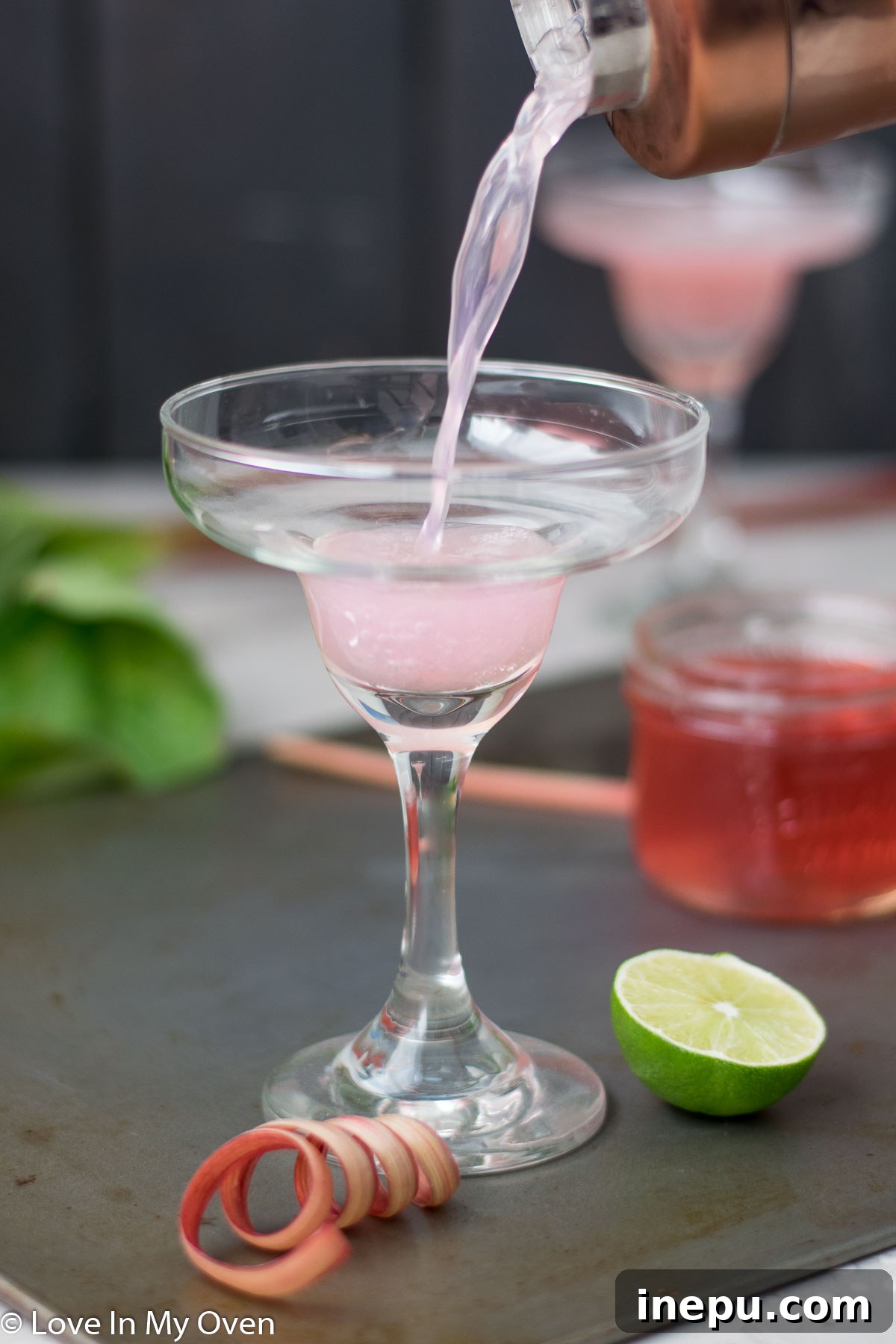 Refreshing Rhubarb Gimlet 5 Two Rhubarb Gimlets garnished with lime slices
