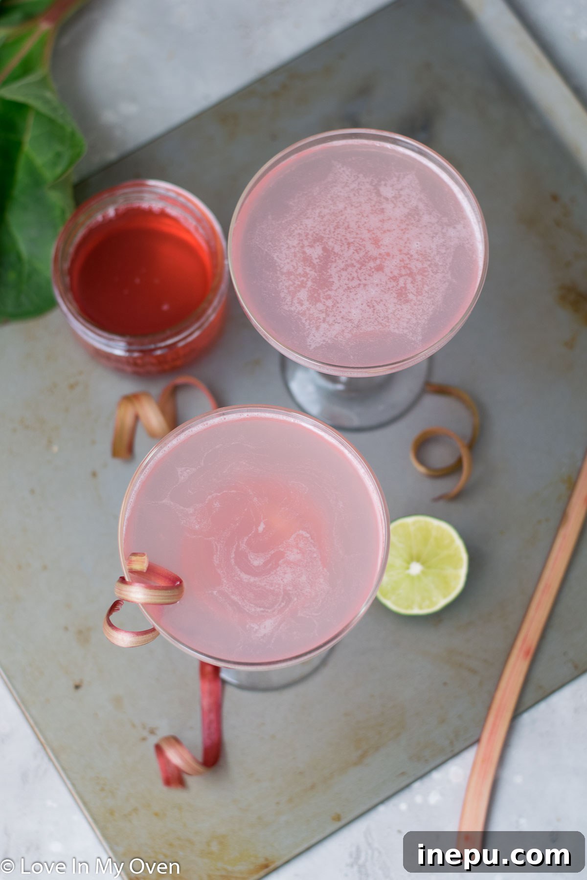 Refreshing Rhubarb Gimlet 7 Rhubarb Gimlet in a cocktail glass on a wooden surface