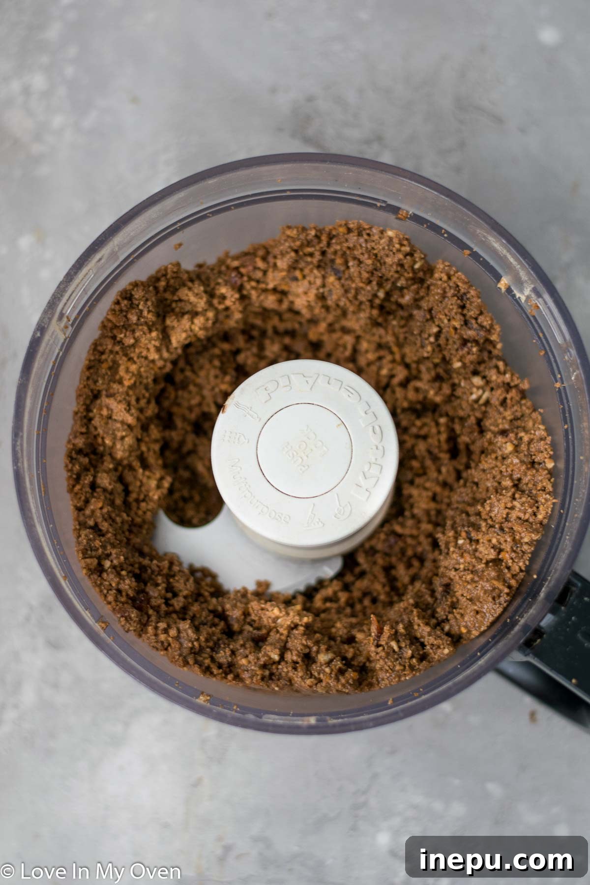 Salted Pretzel Caramel Chocolate Tart 4 Crust ingredients being processed in a food processor for the pretzel tart