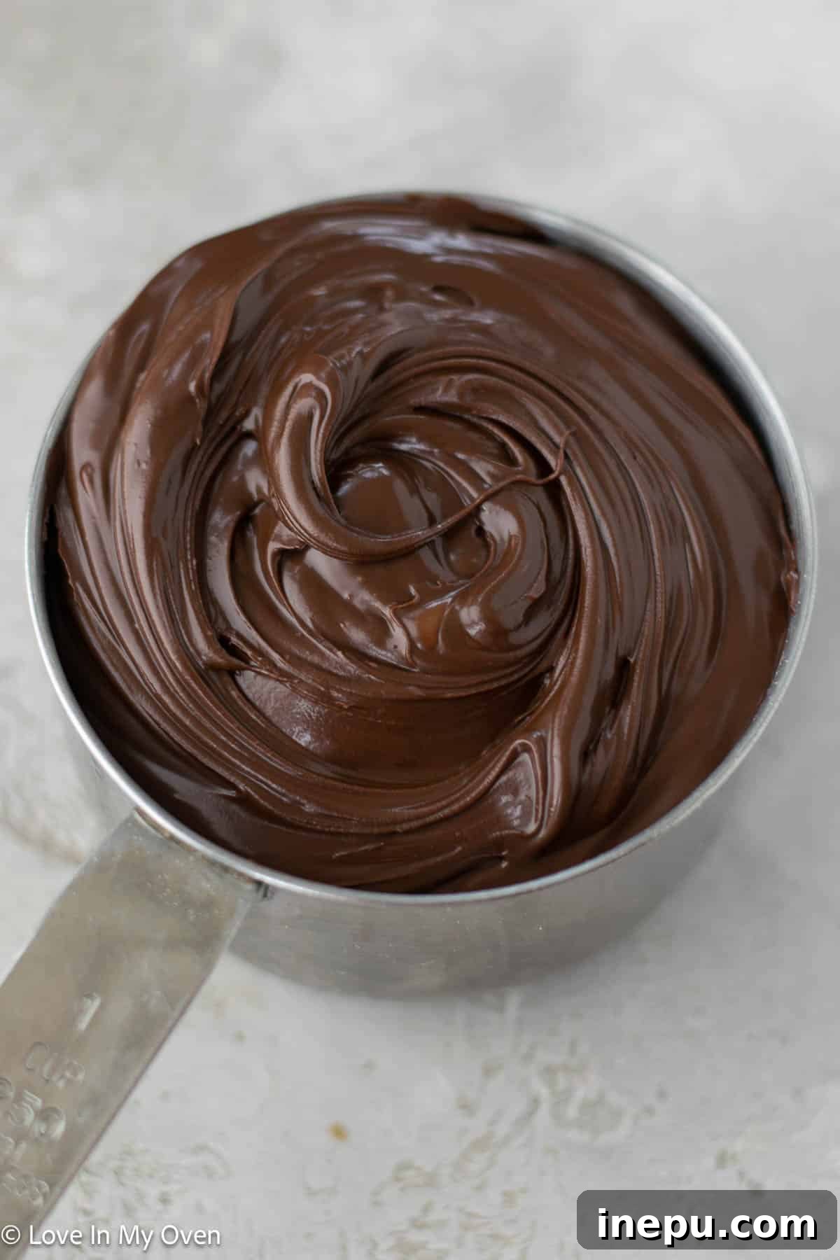 Irresistible Nutella Swirl Rolls 8 spreading nutella on cinnamon roll dough