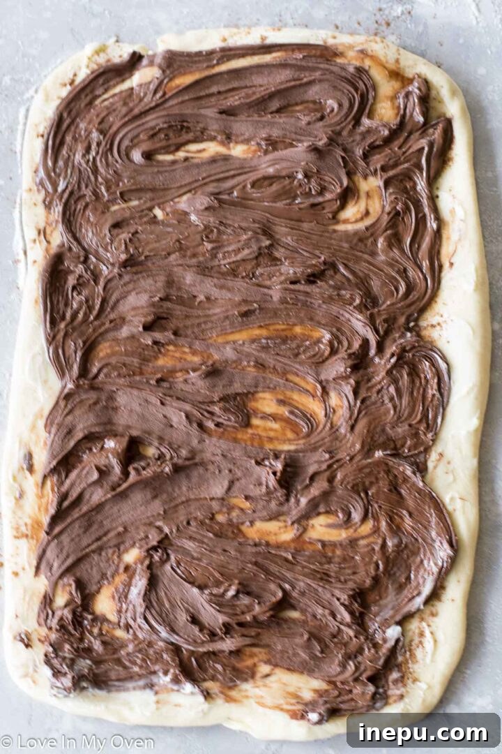 Irresistible Nutella Swirl Rolls 9 rolling nutella cinnamon roll dough