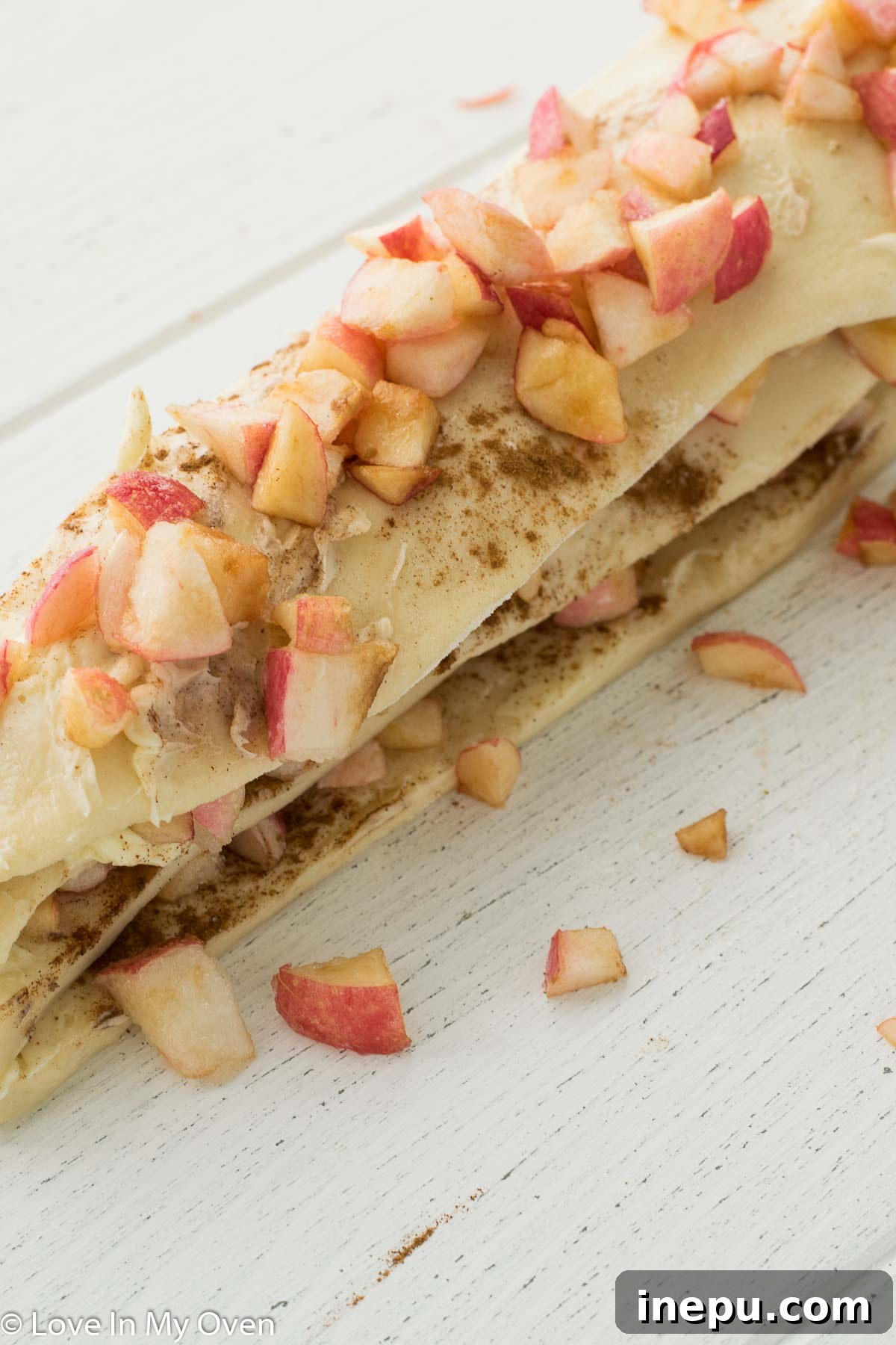 Golden Apple Cinnamon Tear-Apart Bake 8 Layering dough strips with apple filling