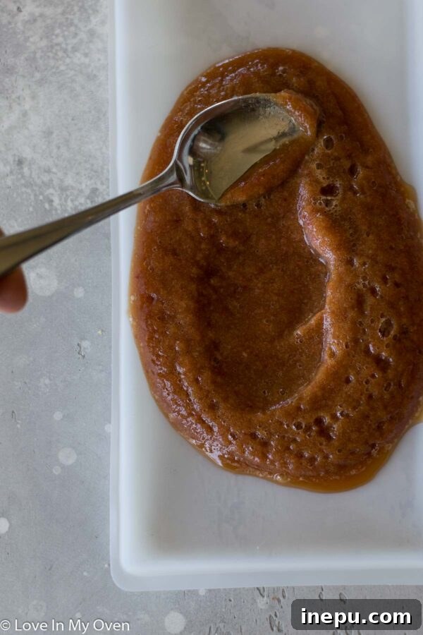 Apple puree spread thinly on a dehydrator tray.