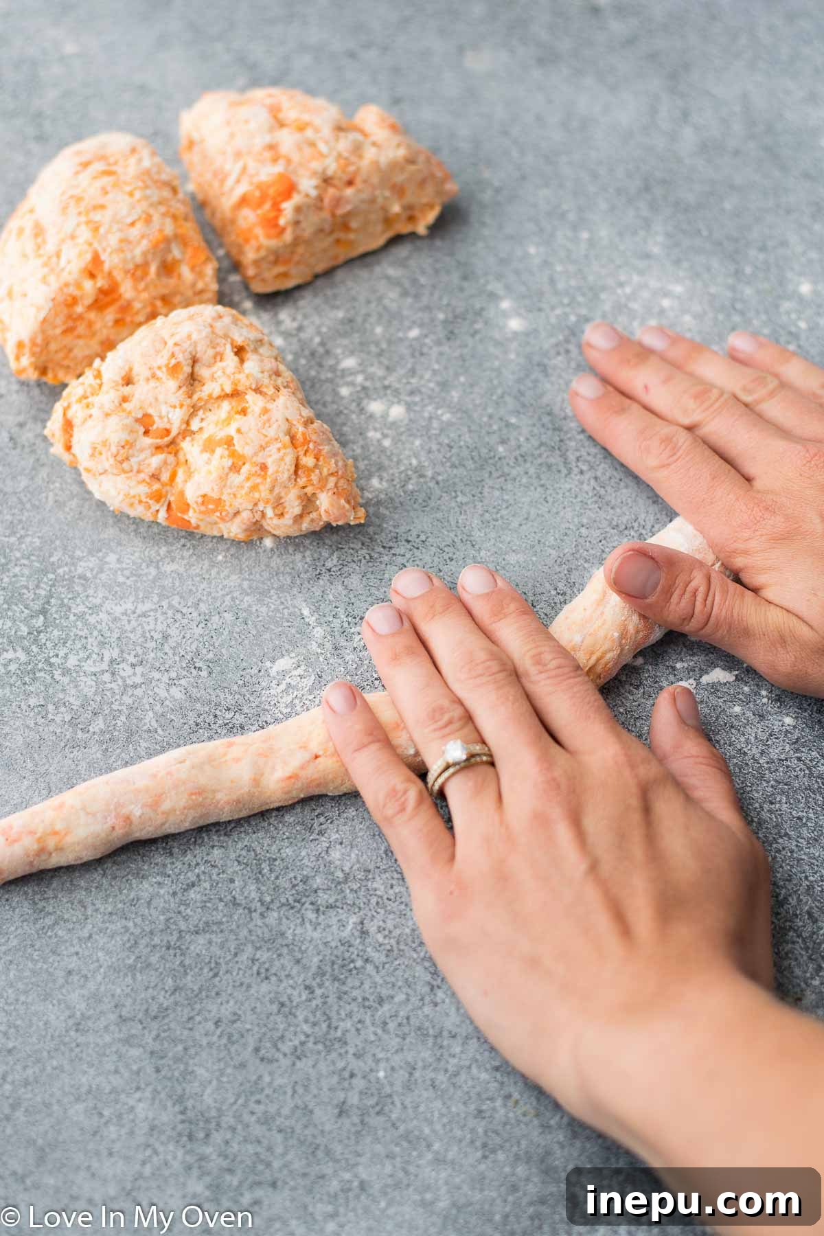 sweet potato gnocchi dough being rolled into ropes