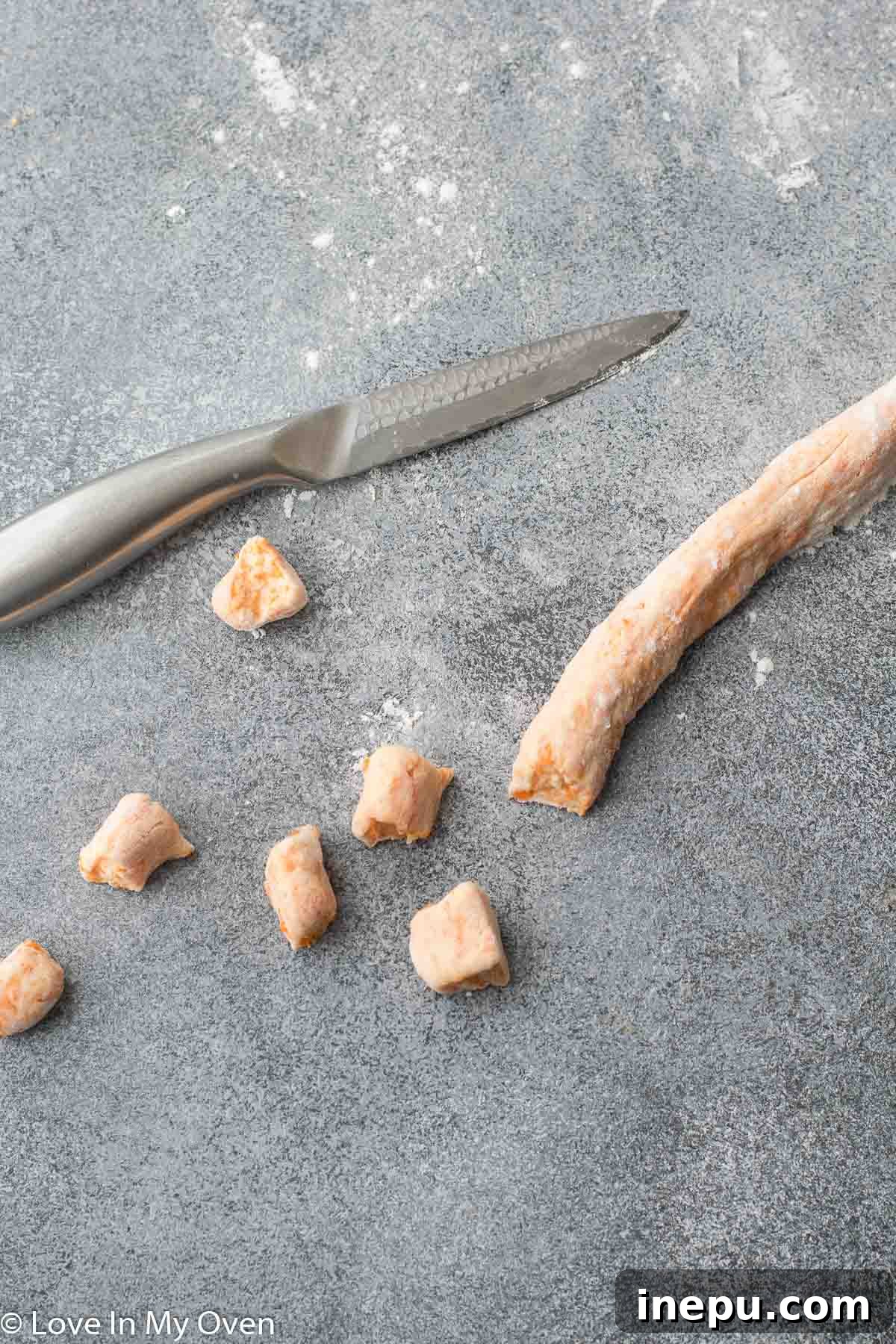 sweet potato gnocchi pieces cut from ropes