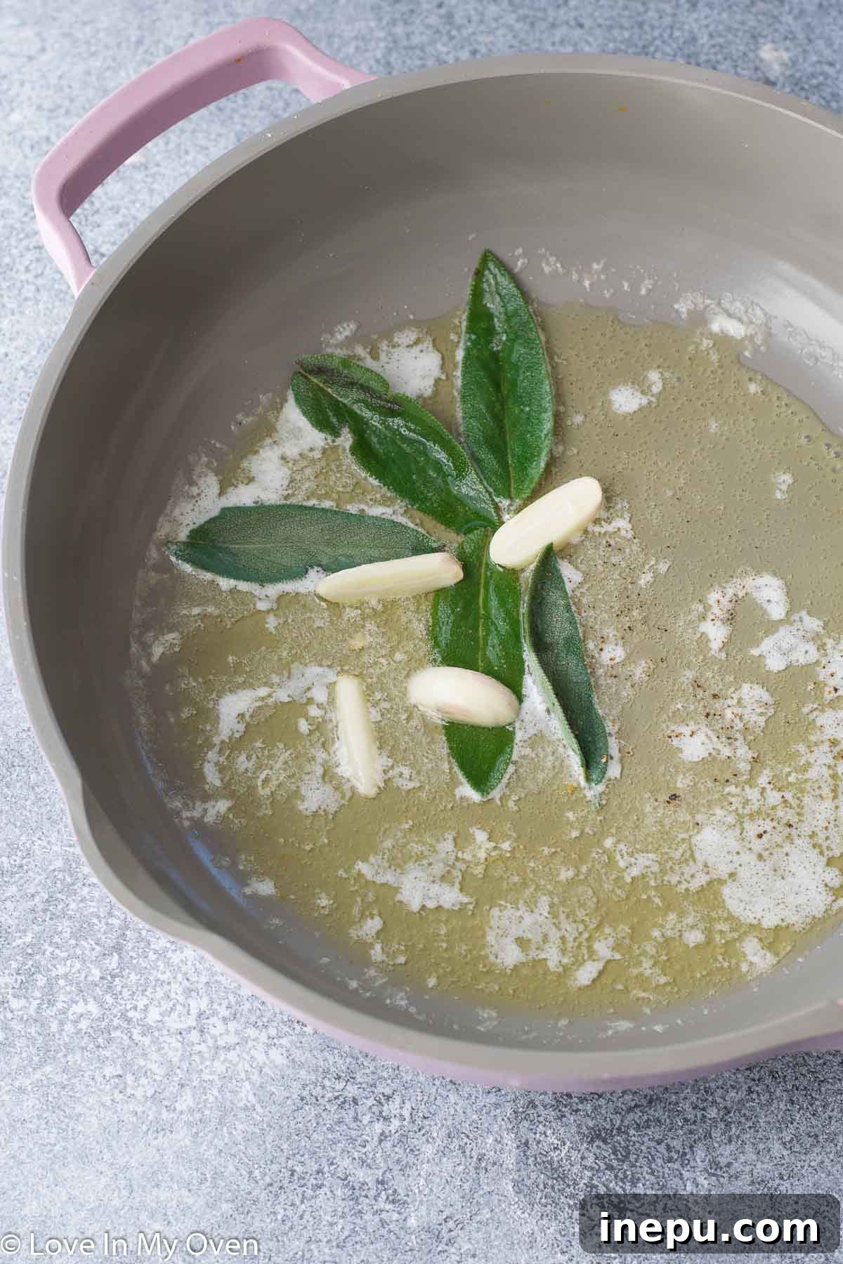 sage butter sauce simmering in a skillet