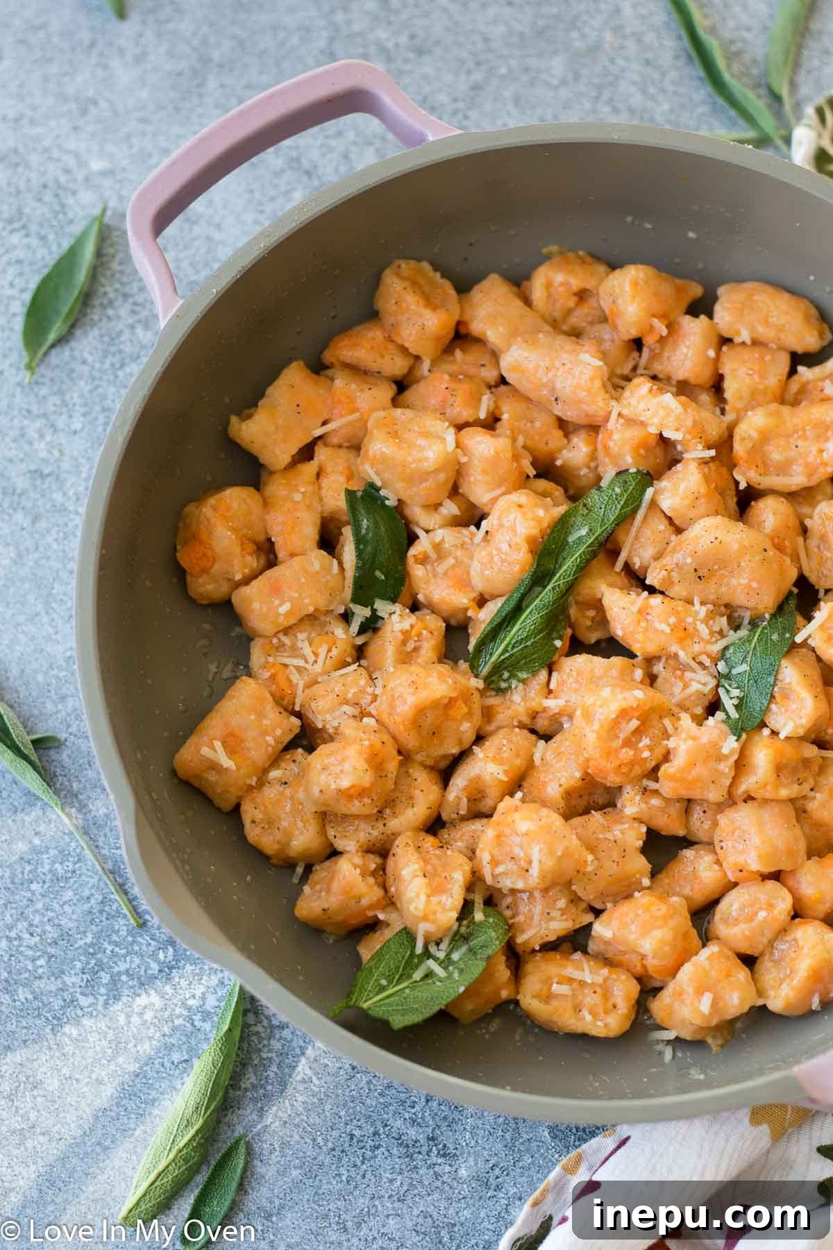 plated sweet potato gnocchi with parmesan and pepper
