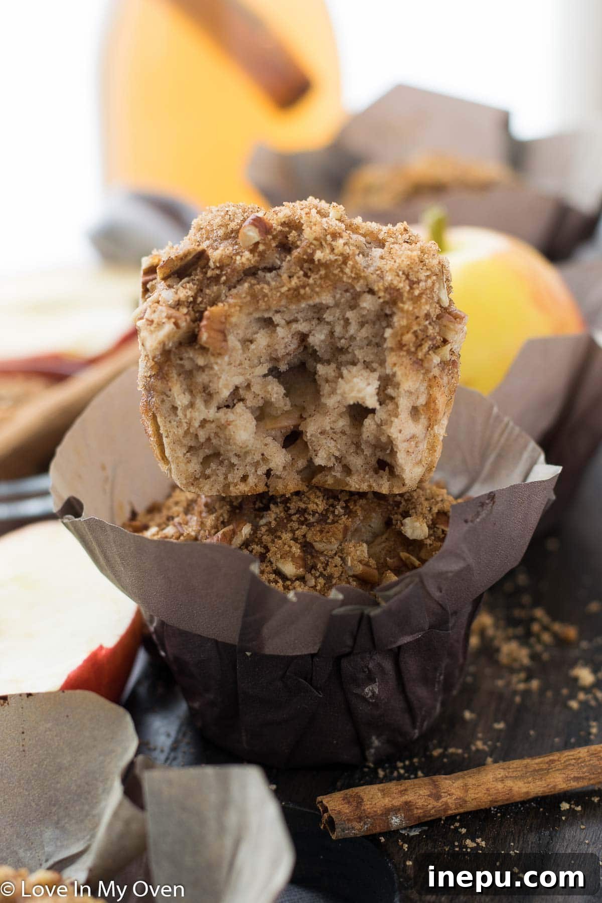 Harvest Spiced Cider Muffins 10 Close-up of a single apple cider muffin with a detailed view of its streusel topping.