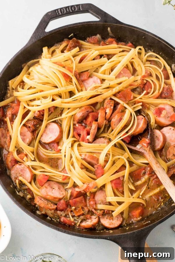 Hearty Shrimp and Sausage Pasta 6 Stirring all the ingredients in a one-pot pasta dish before cooking