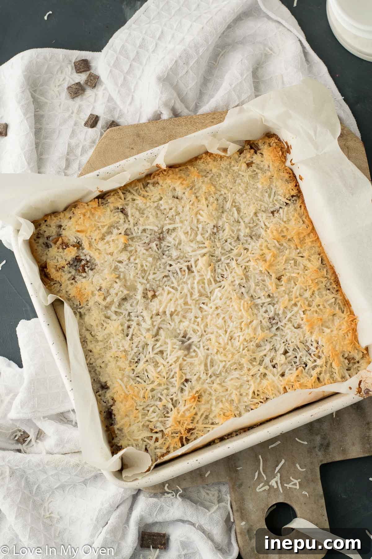 Plant-Based Dream Bars 8 Baked vegan magic bars cooling in the pan before slicing.