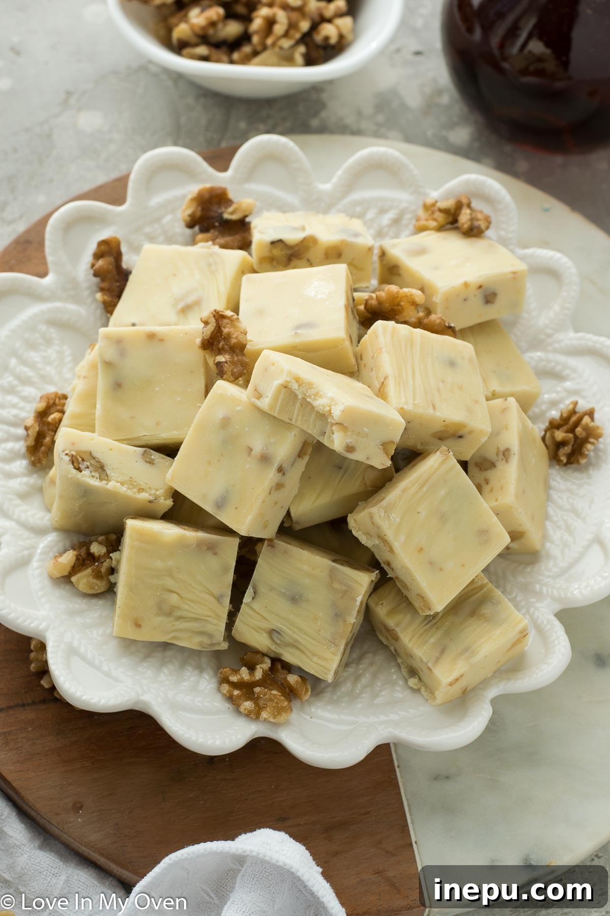 Decadent Maple Walnut Fudge squares on a cooling rack, ready for gifting.