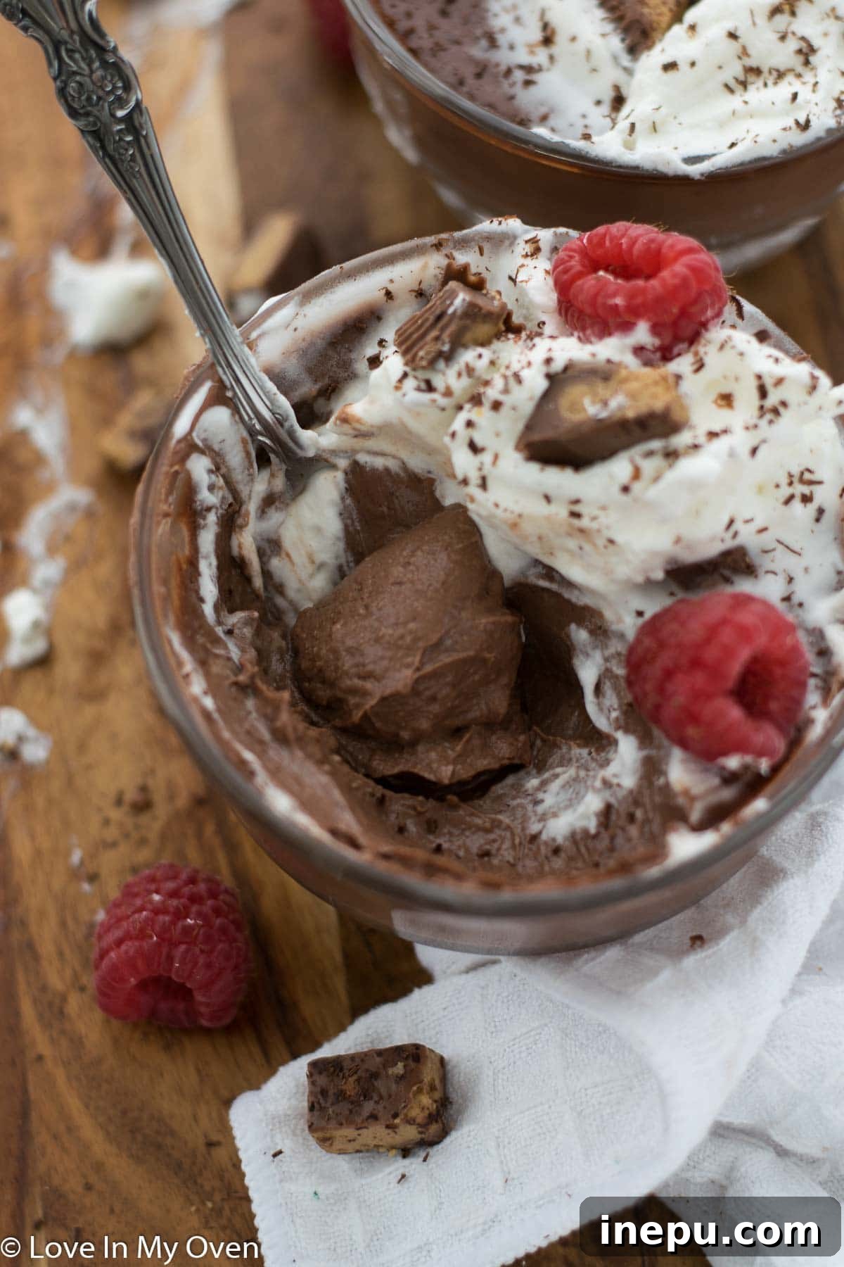 Overhead shot of vegan chocolate peanut butter pudding with spoon