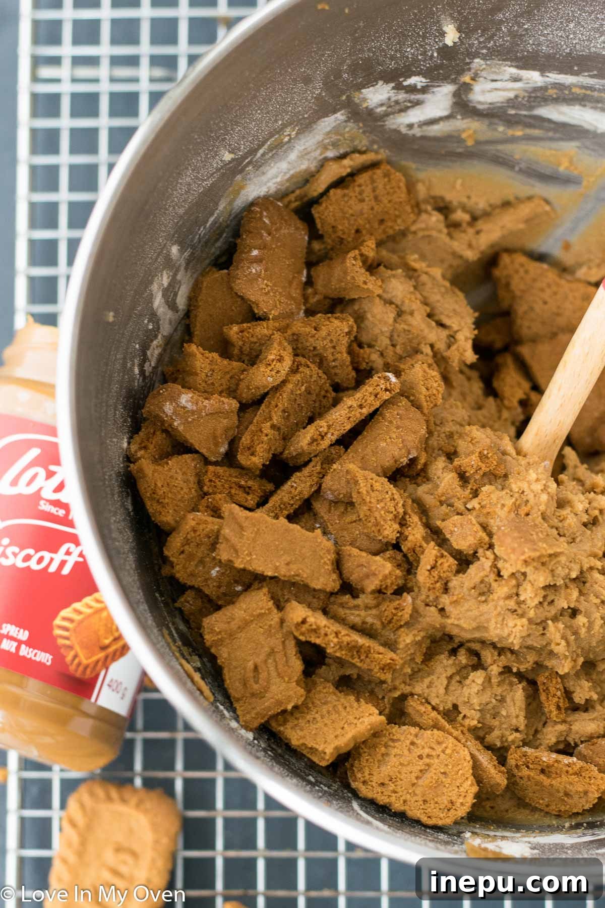 Cookie dough with Biscoff chunks being mixed