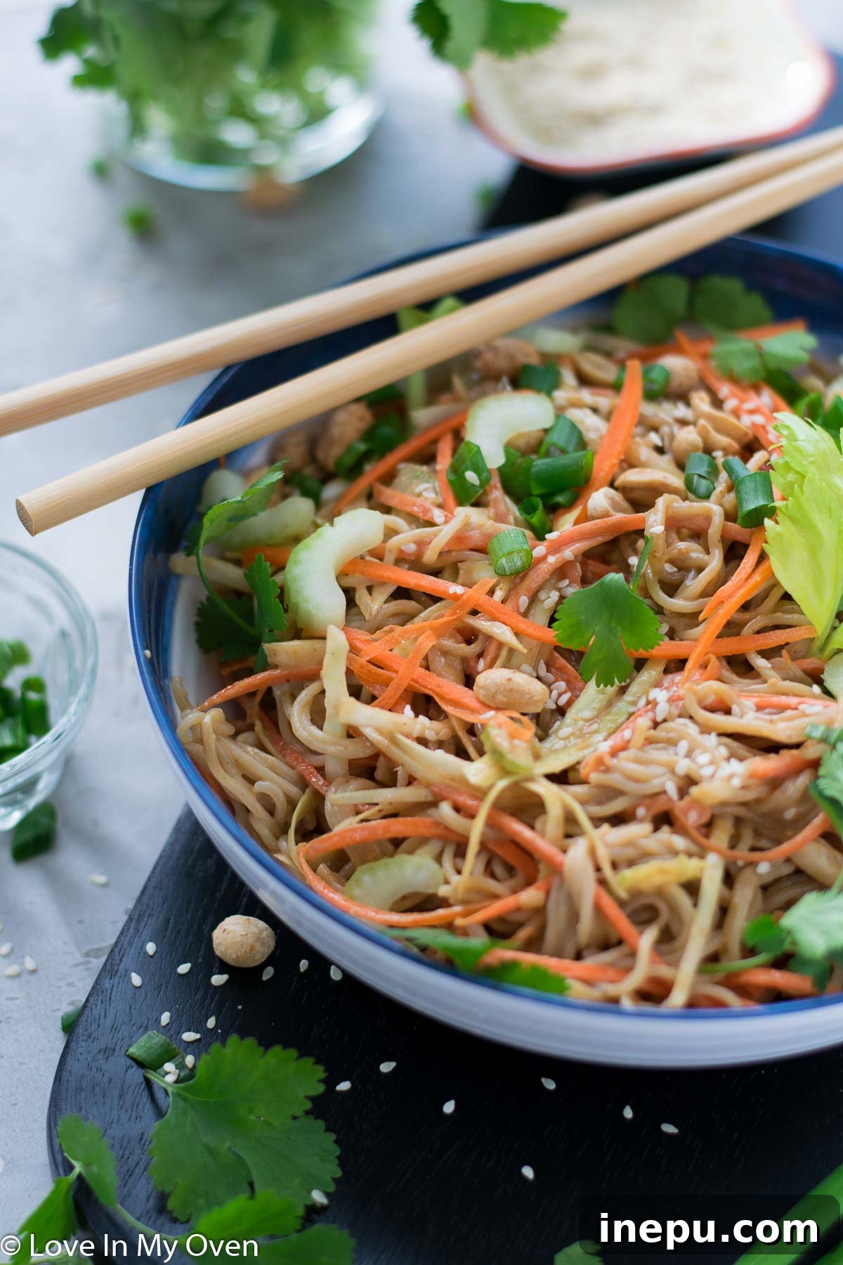 A serving of cold sesame peanut noodle salad in a small bowl