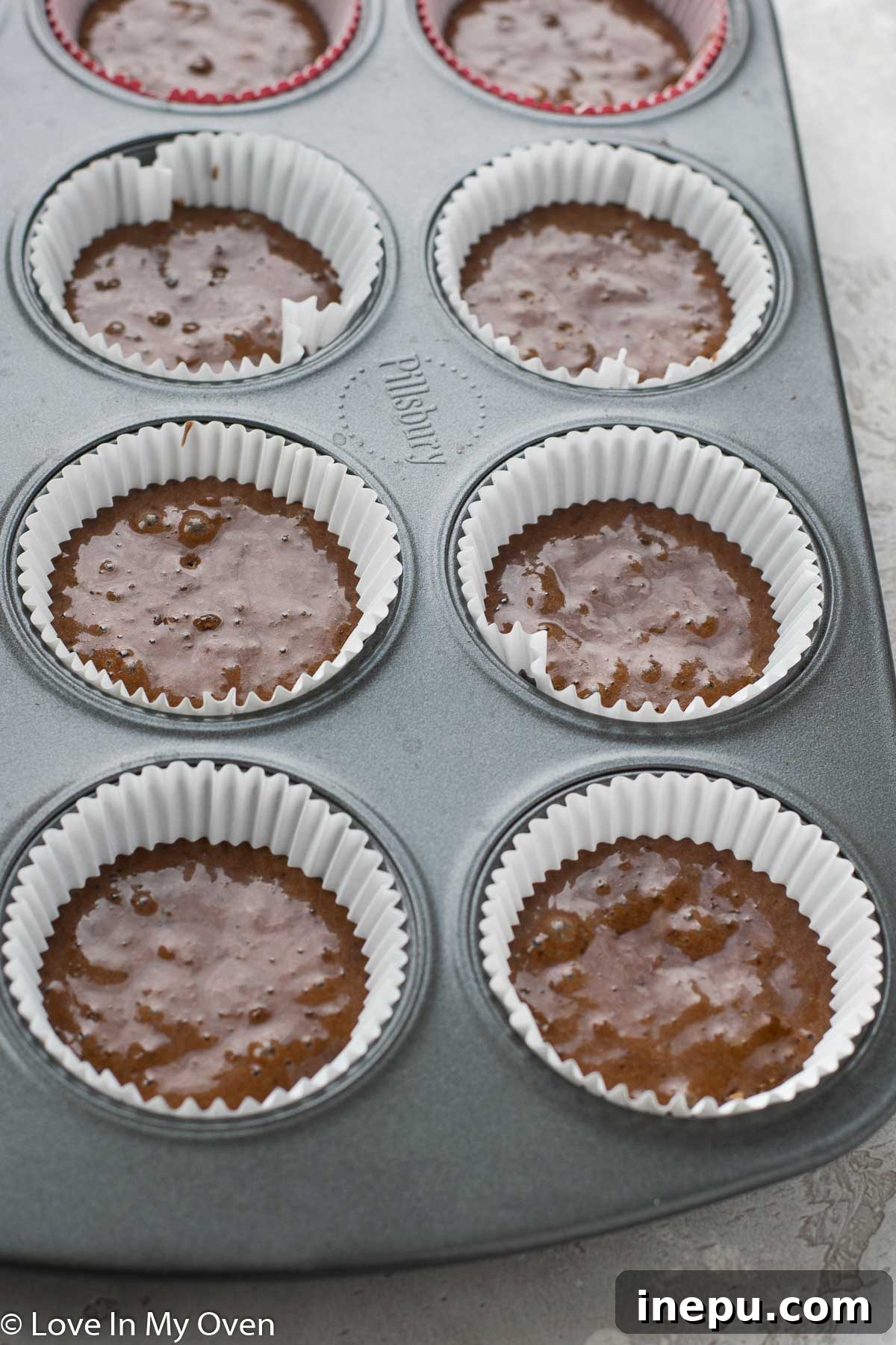 Black Tie Treats 5 Cupcake liners filled halfway with batter
