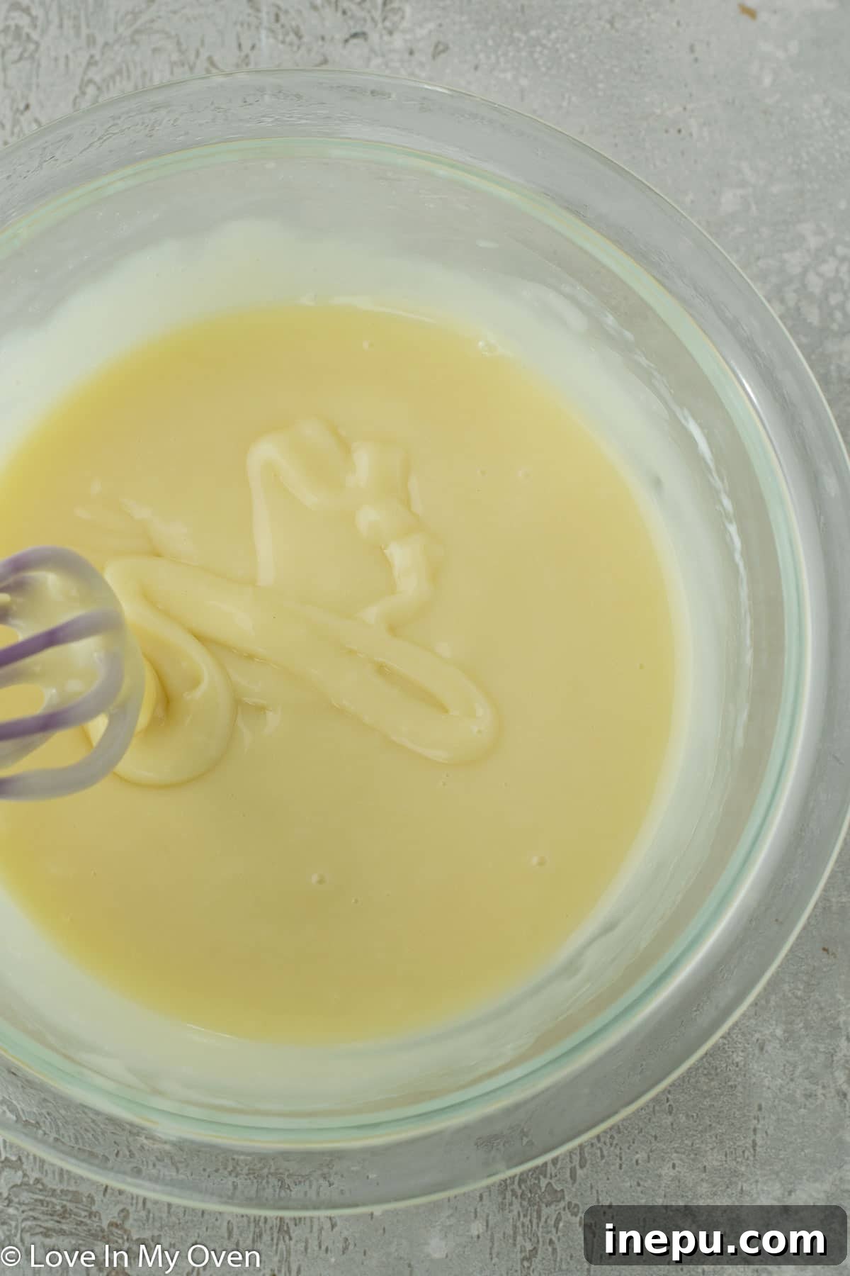 Black Tie Treats 6 Smooth white chocolate ganache in a bowl