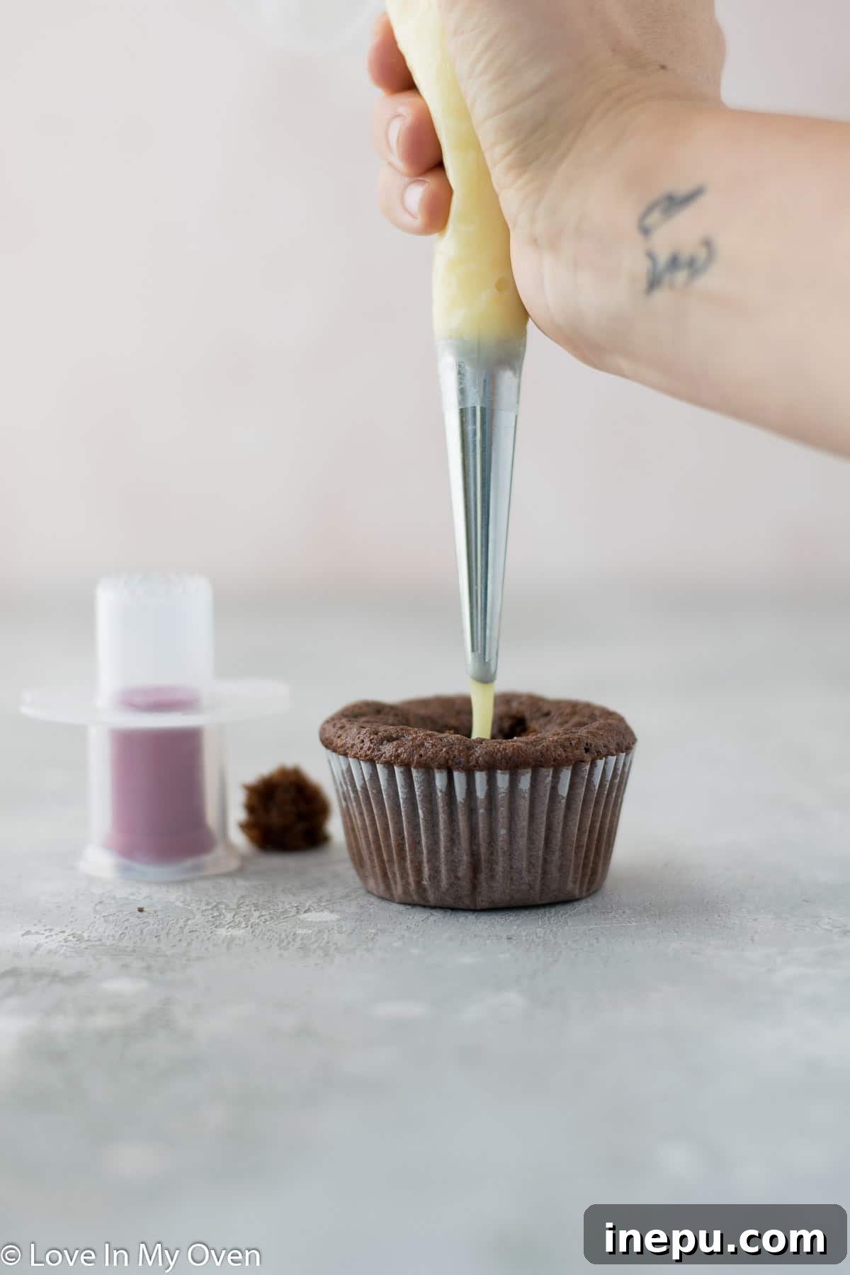 Black Tie Treats 8 Filling a cored cupcake with white chocolate ganache