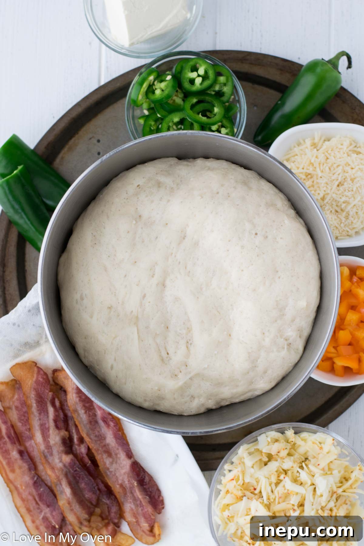 Homemade Parmesan pizza dough rolled out and ready for toppings