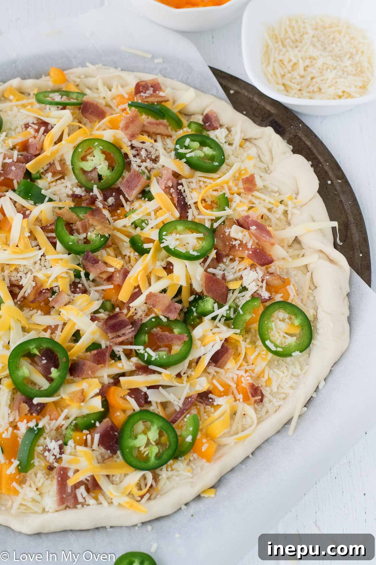 Fully topped Jalapeño Popper Pizza ready for baking