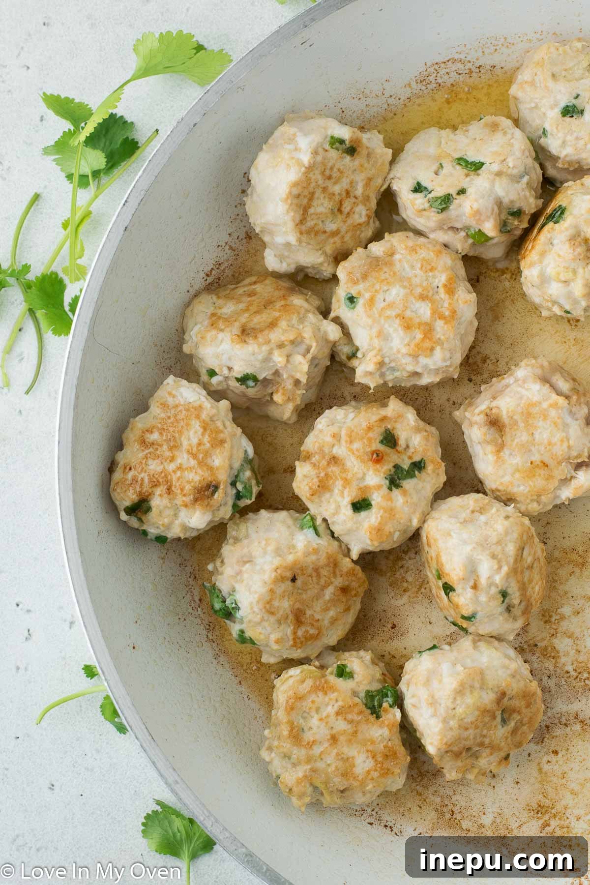 cooked chicken meatballs in pan