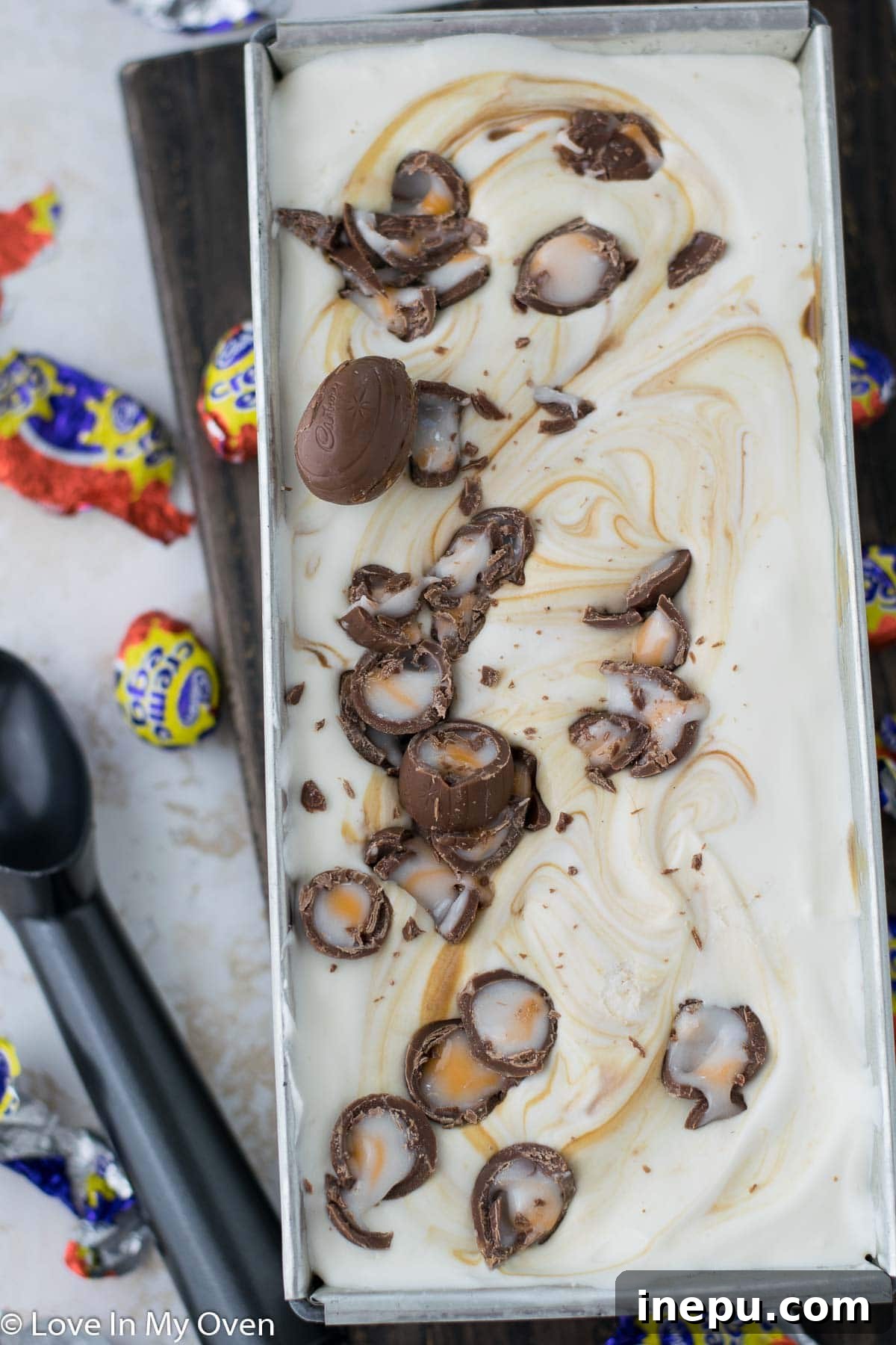 Silky Smooth Crème Egg Ice Cream 6 Top view of layered Crème Egg ice cream with caramel swirls before freezing.