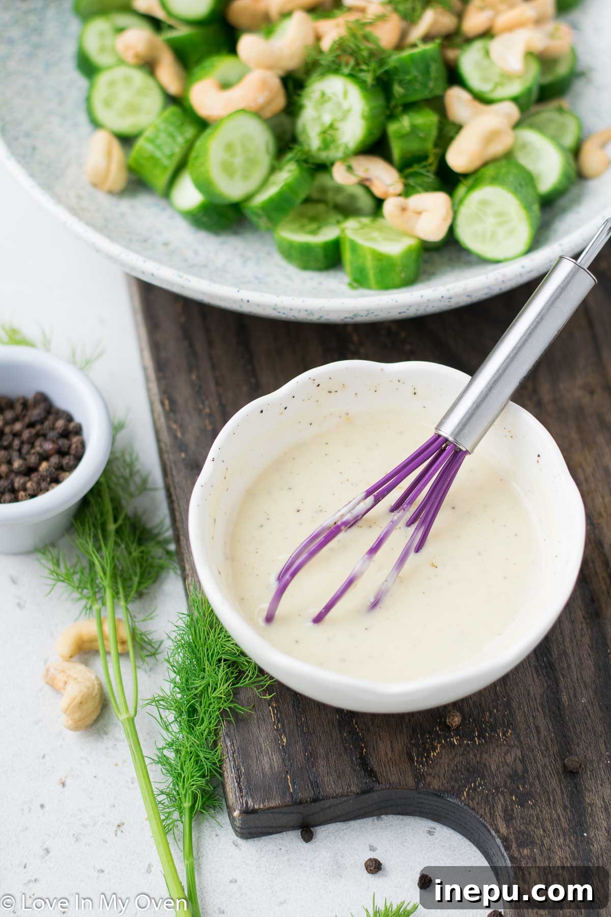 Mixing the Zesty Dressing Whisking the creamy dill dressing for the cucumber salad