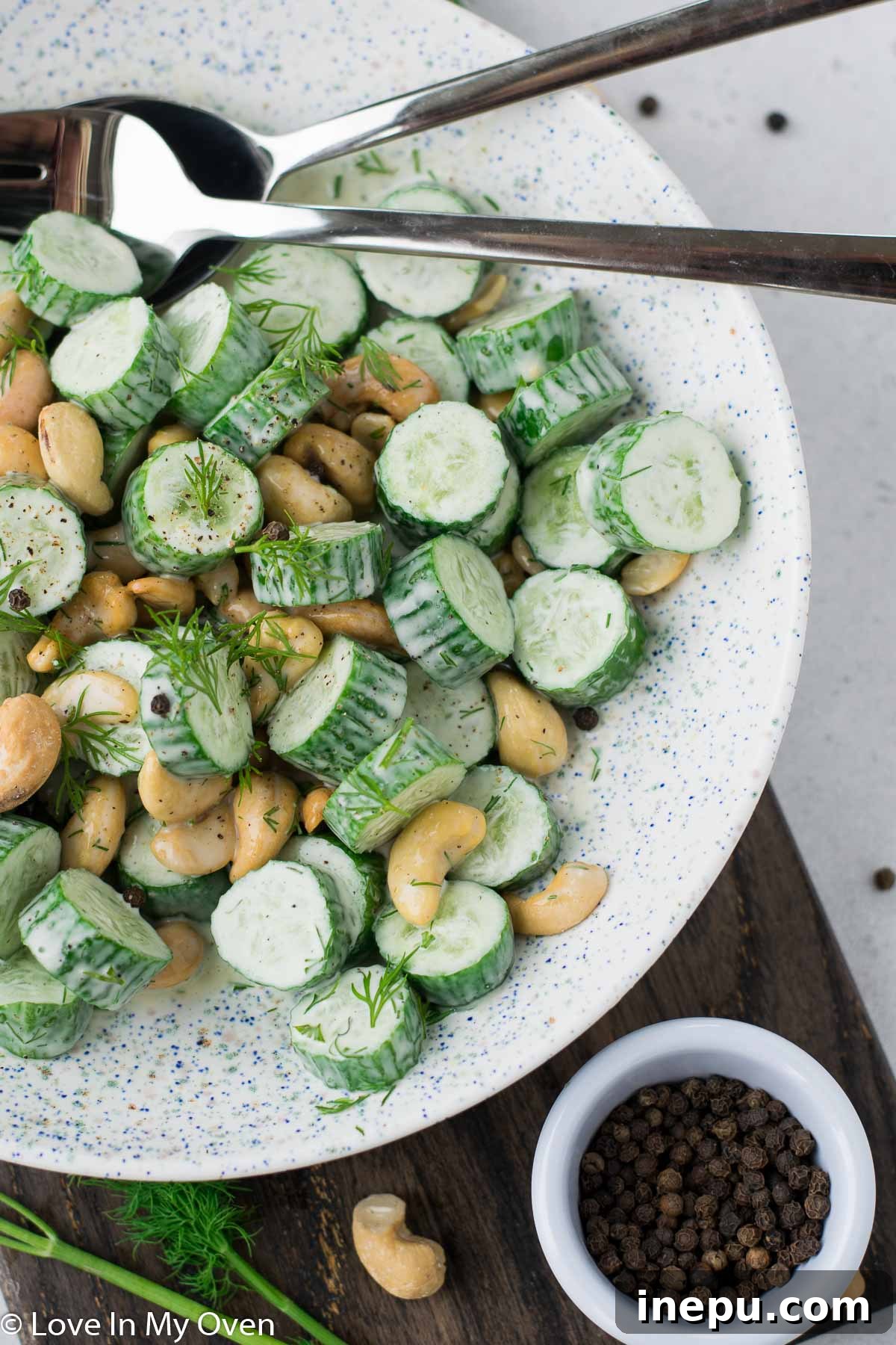 Serving the Delicious Salad cashew dill cucumber salad served in a bowl, ready to eat