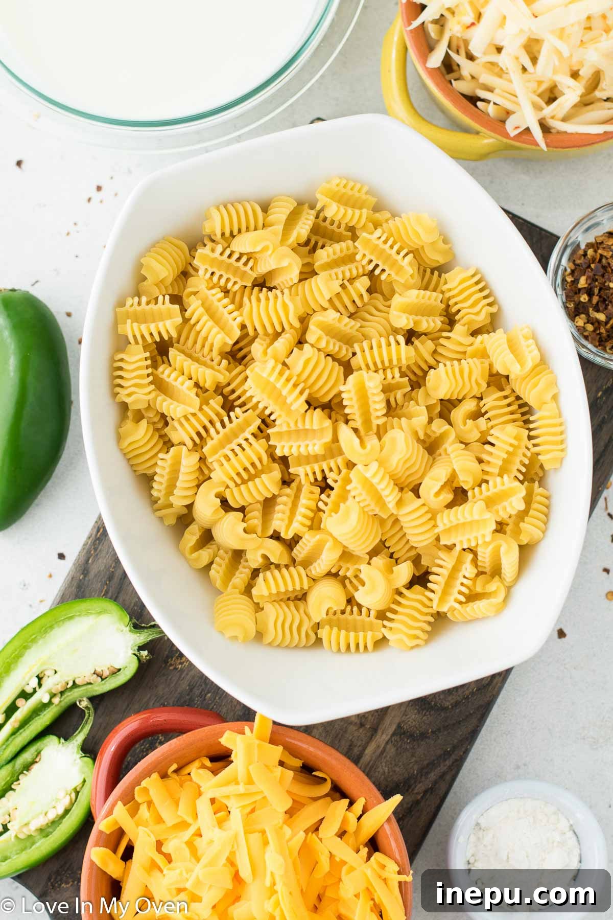 Jalapeno Zing Mac 3 Assortment of fresh ingredients for jalapeno mac and cheese on a cutting board