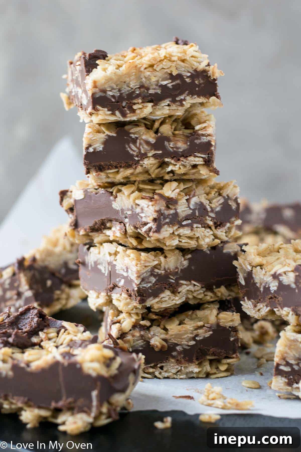 gluten free oatmeal fudge bars - a close-up showing the layers of oat base, chocolate fudge, and oat topping