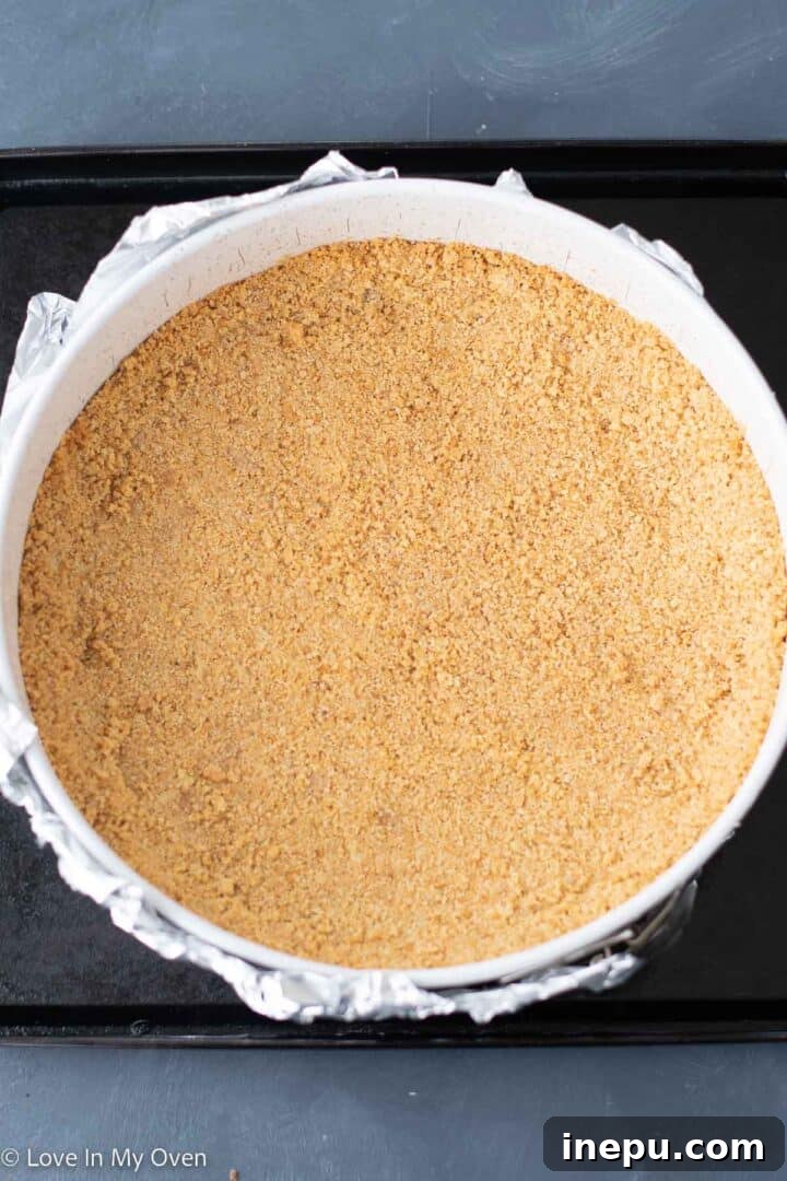 Decadent Toblerone Cheesecake 5 Mixing Toblerone chunks into cheesecake batter.