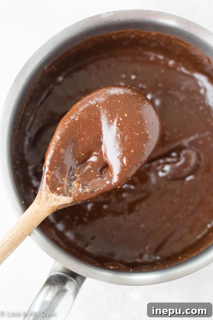 Nourishing Homemade Energy Bars 5 Smooth melted chocolate mixture, ready for oats and peanuts