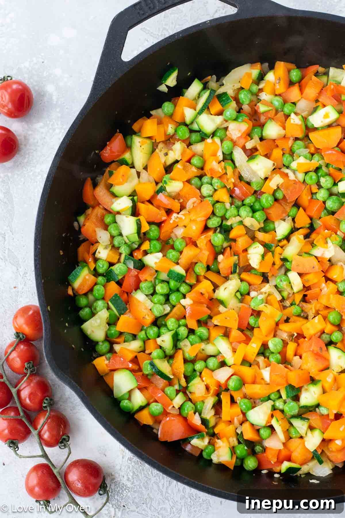 Cheesy Baked Veggie Pasta 5 Cooked pasta and sautéed vegetables combined with tomato sauce in a large skillet